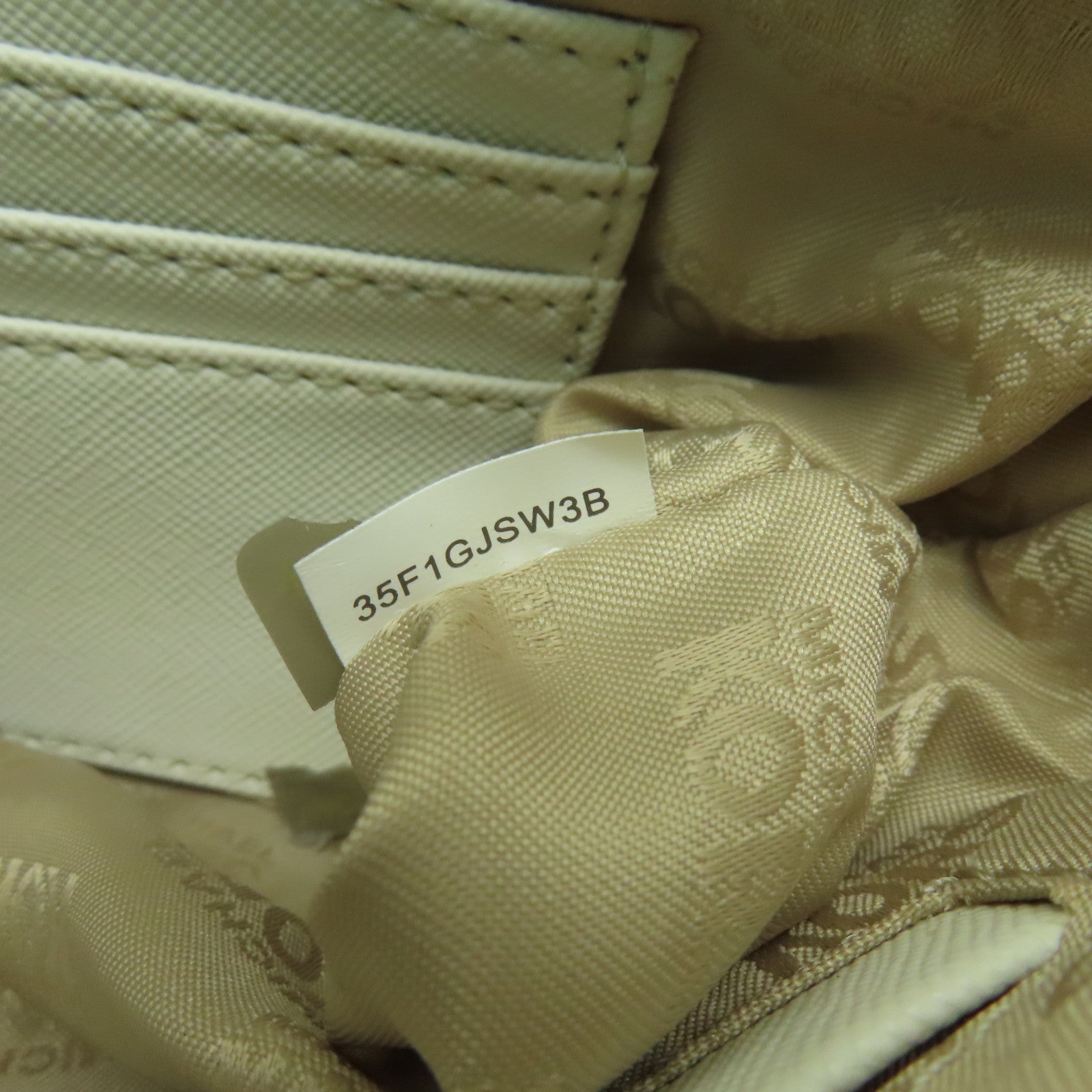 Michael Kors 塗層帆布LG Wristlet金扣手挽袋白色