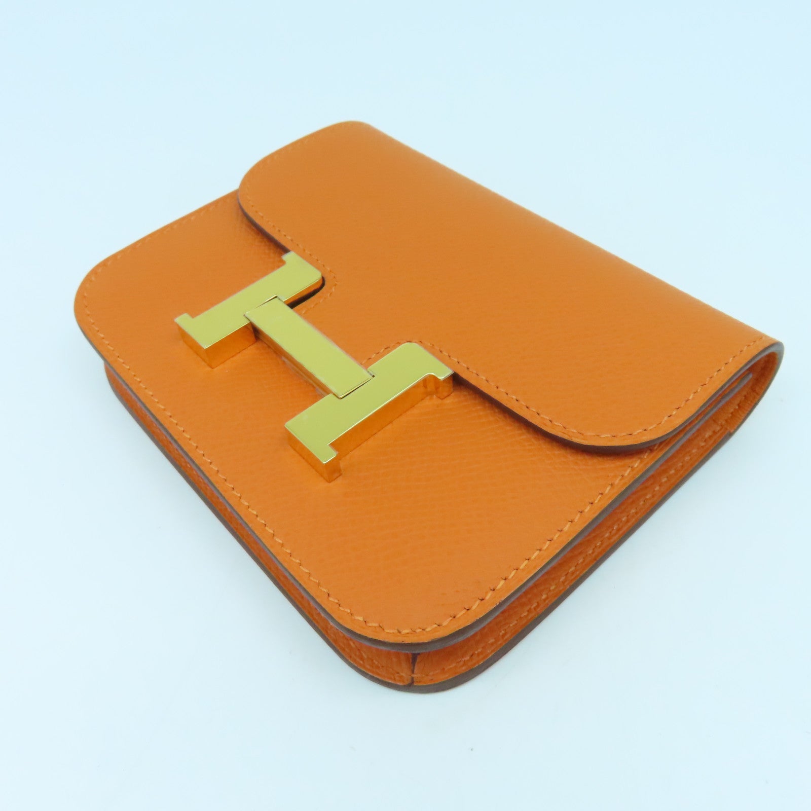 HERMES Epsom皮革Constance Silm金扣錢包橙色