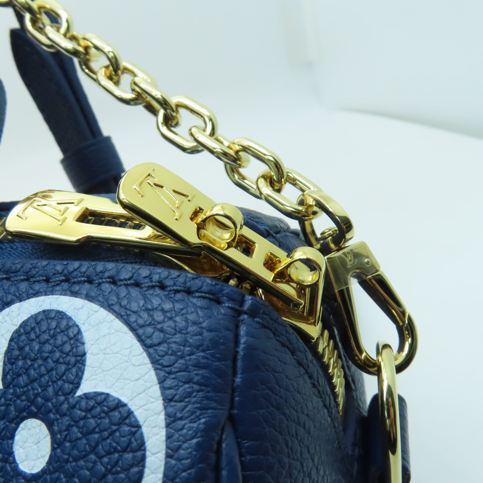 LOUIS VUITTON Monogram Empreinte Speedy Bandouliere 20 gold buckle handle shoulder bag blue