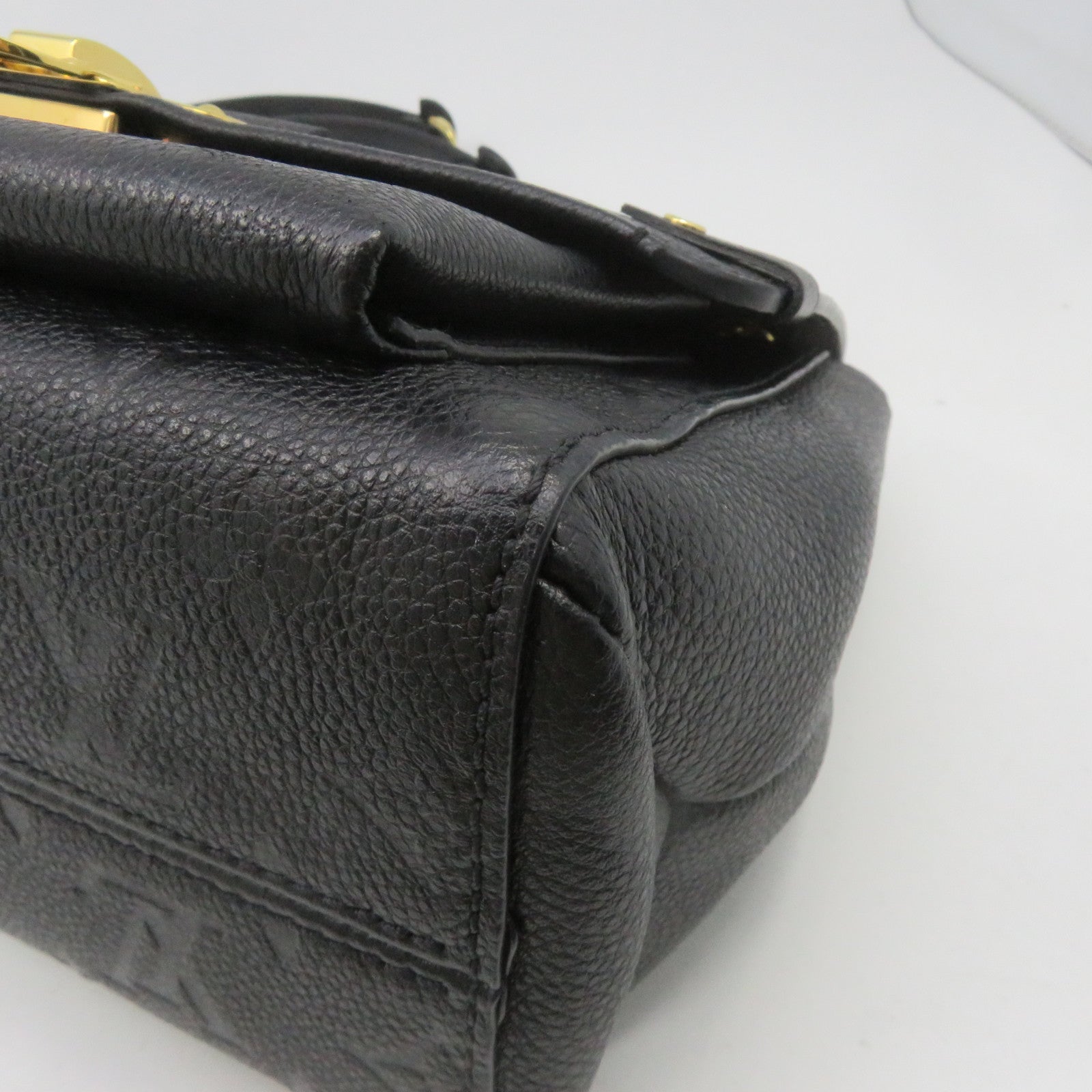 LOUIS VUITTON Monogram Empreinte Vavin PM gold buckle handle bag
