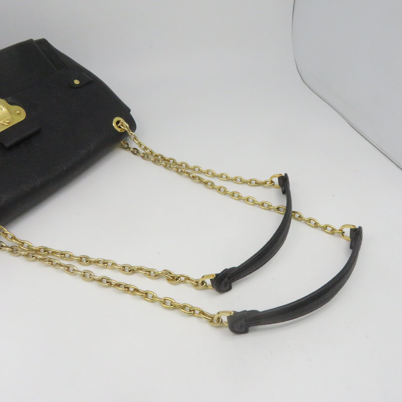LOUIS VUITTON Monogram Empreinte Vavin PM gold buckle handle bag