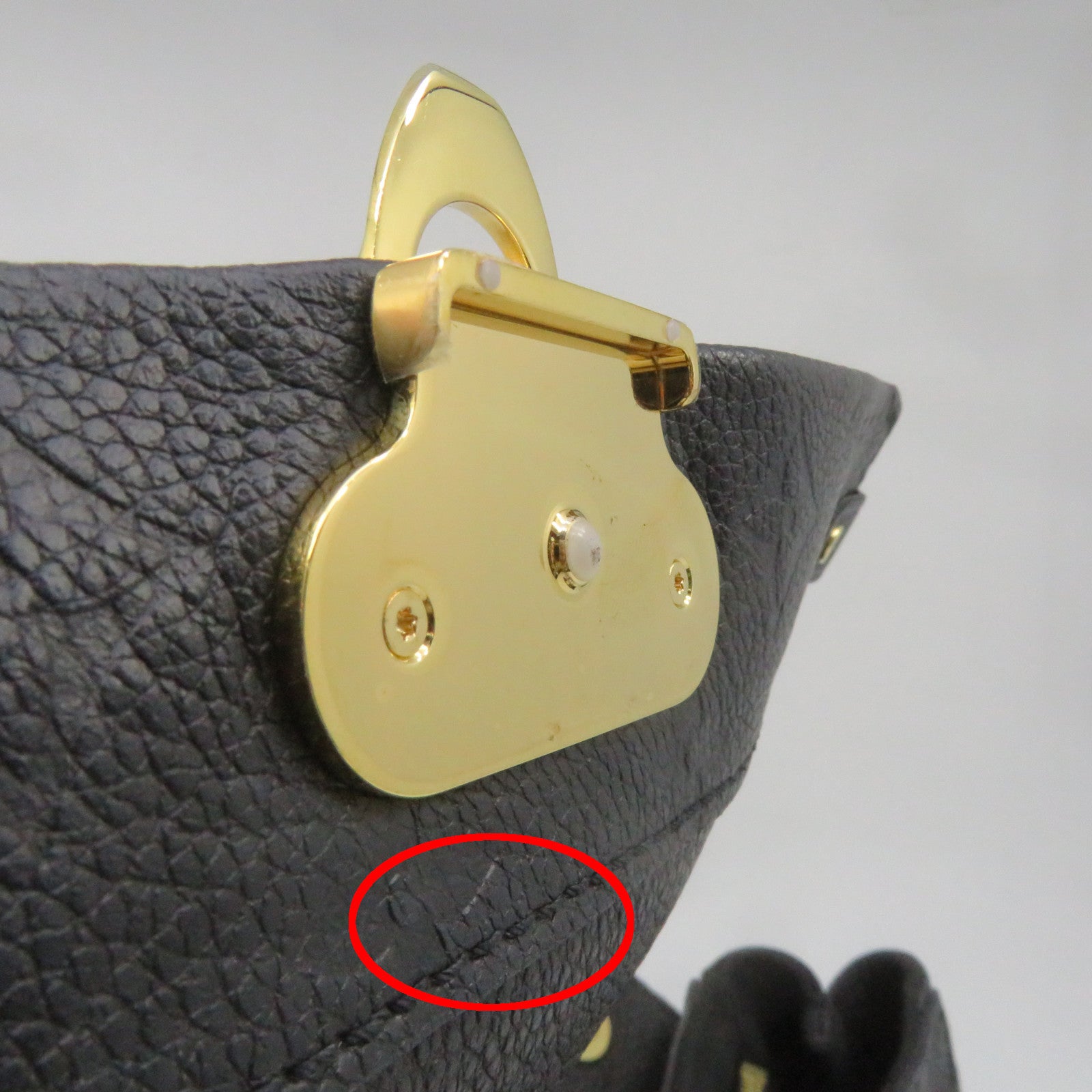 LOUIS VUITTON Monogram Empreinte Vavin PM gold buckle handle bag