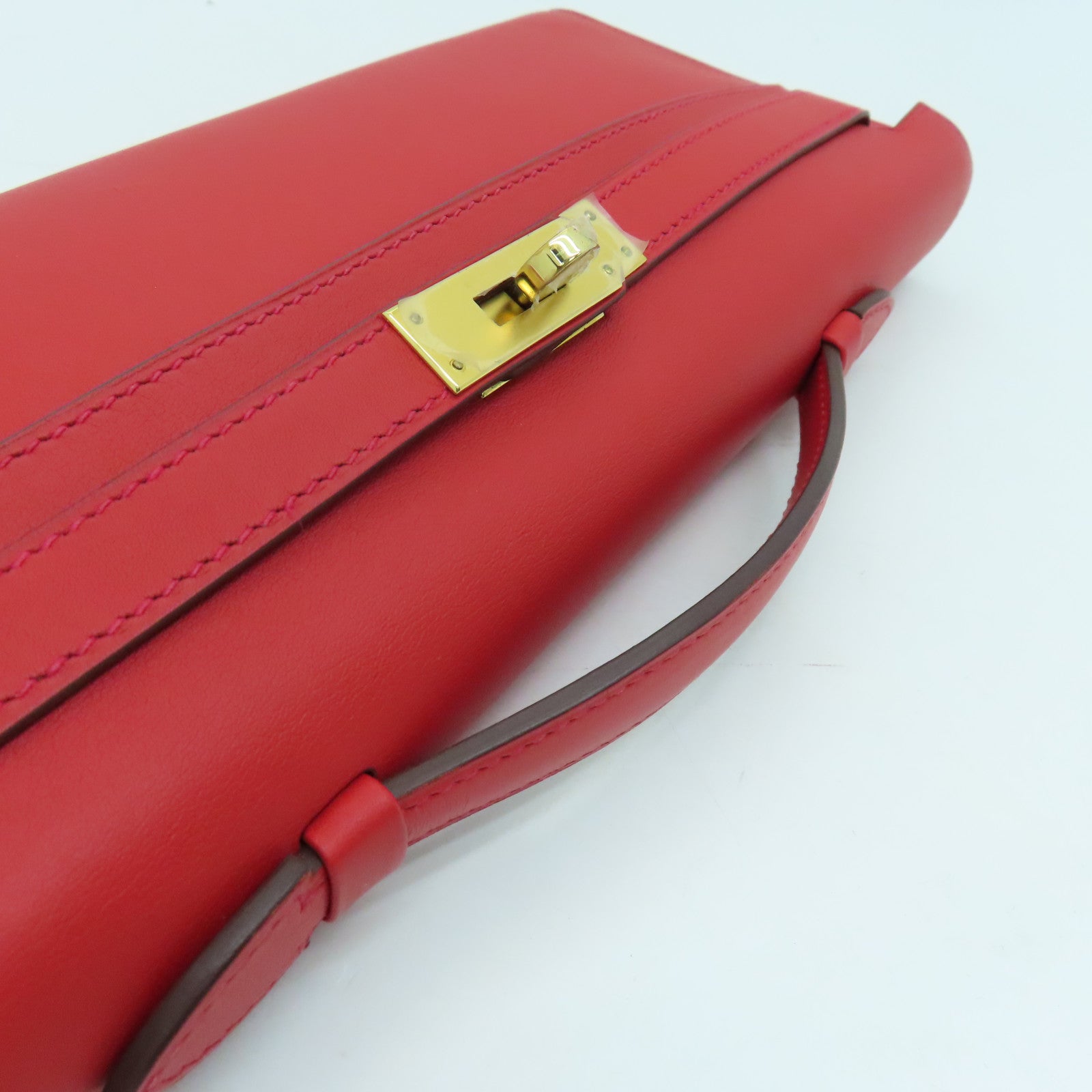 HERMES Swift皮革Kelly Cut金扣手挽袋红色