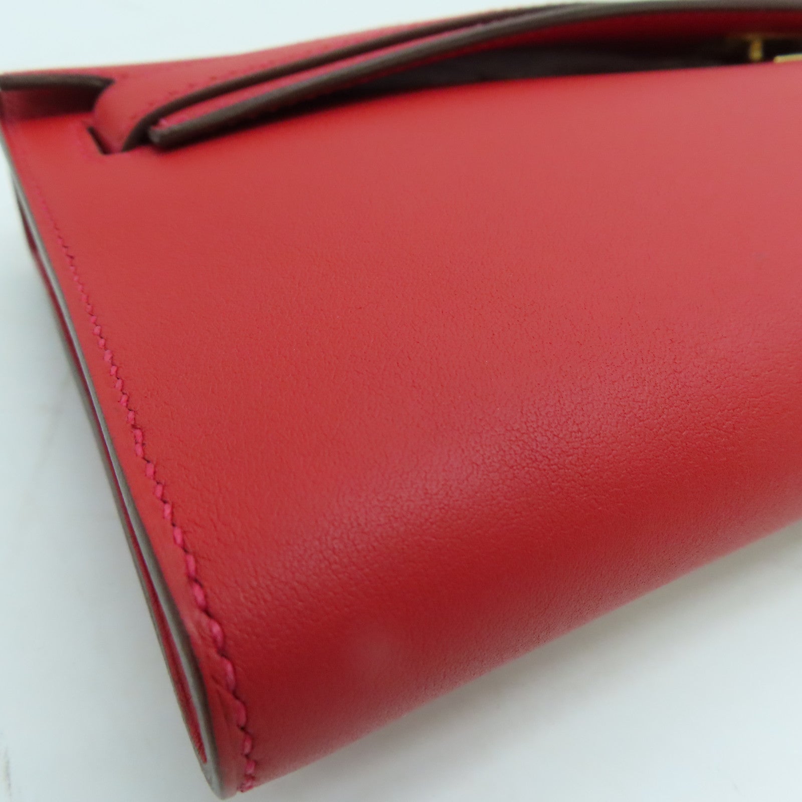 HERMES Swift皮革Kelly Cut金扣手挽袋红色