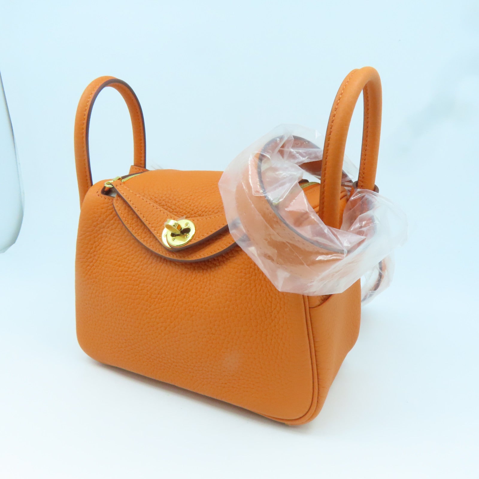 HERMES Clemence皮革Mini Lindy金扣手挽肩背兩用袋經典橘
