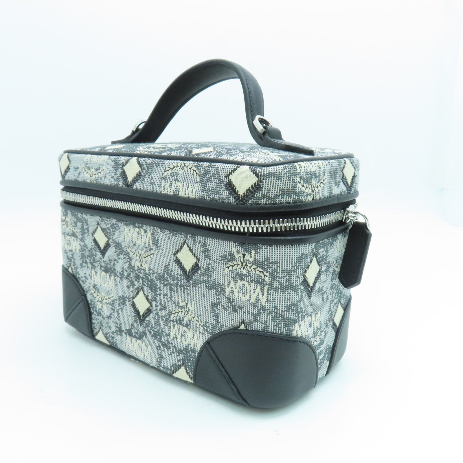 MCM 帆布Vanity Case銀扣手挽袋黑色/白色
