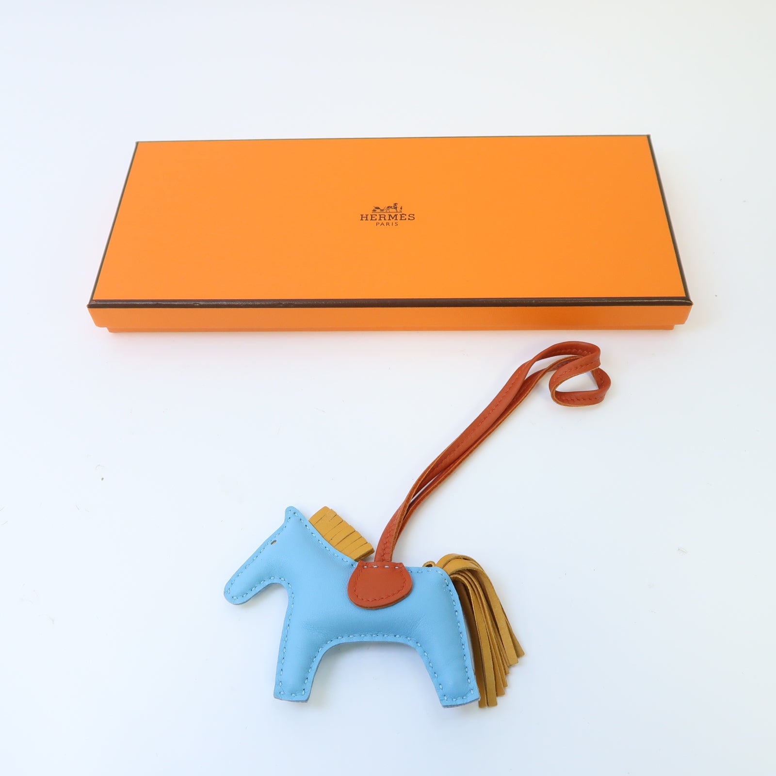 HERMES Swift皮革Rodeo PM掛飾Bleu Du Nord北方藍色/橙色/黃色