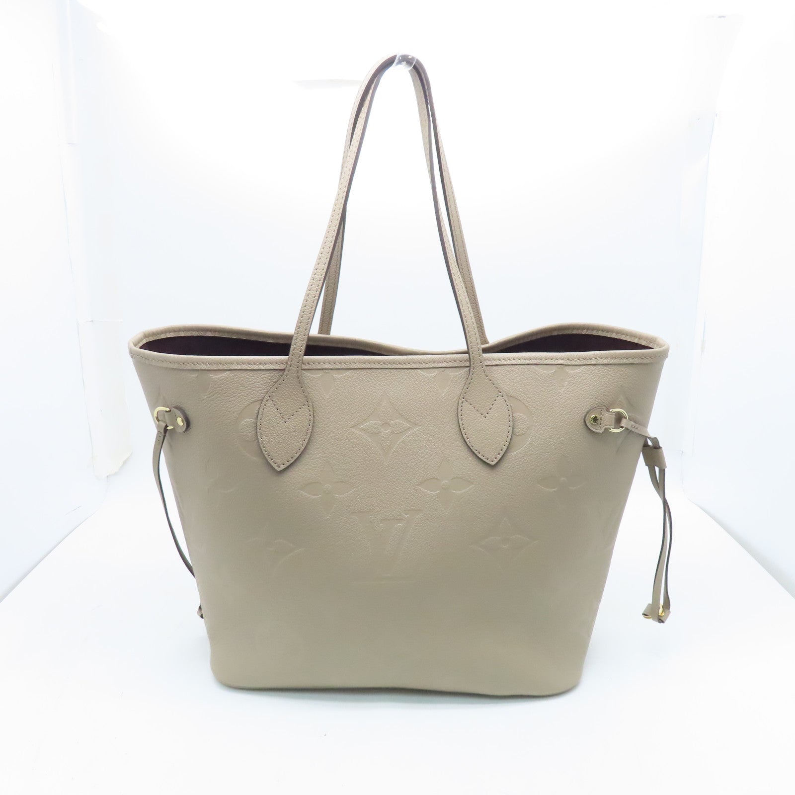 LOUIS VUITTON Monogram Empreinte Neverfull MM gold buckle handle bag light brown