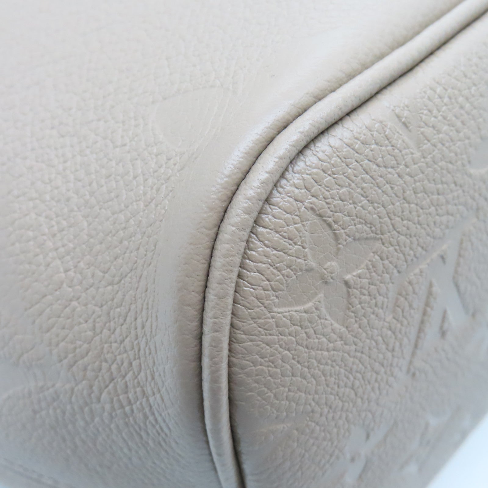 LOUIS VUITTON Monogram Empreinte Neverfull MM gold buckle handle bag light brown