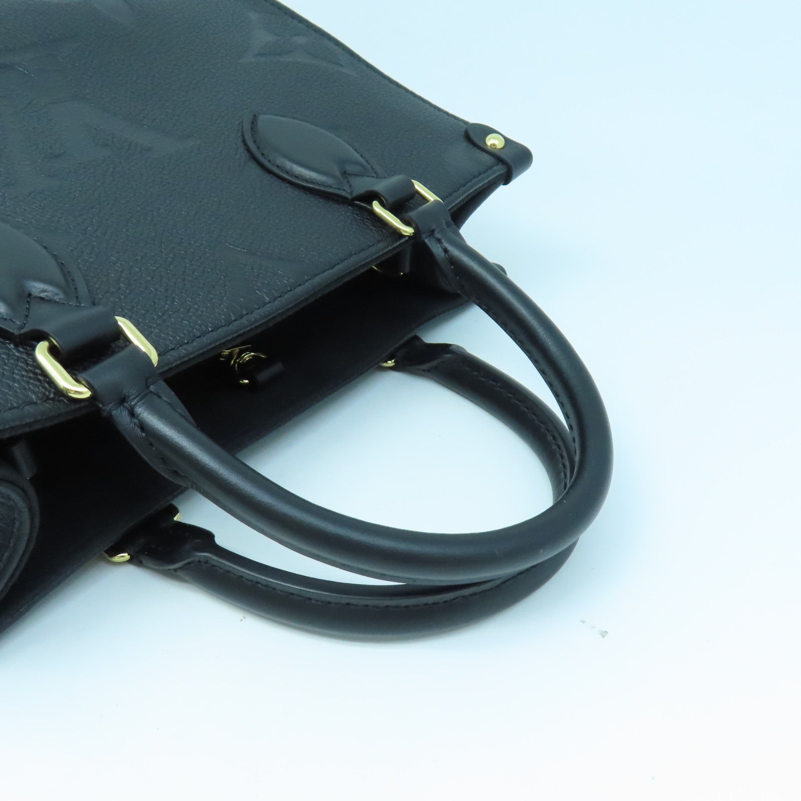 LOUIS VUITTON Monogram Empreinte On The Go PM gold buckle handle shoulder bag dual-use black