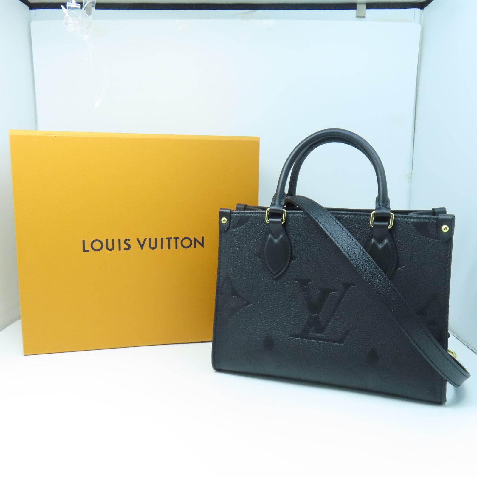 LOUIS VUITTON Monogram Empreinte On The Go PM gold buckle handle shoulder bag dual-use black