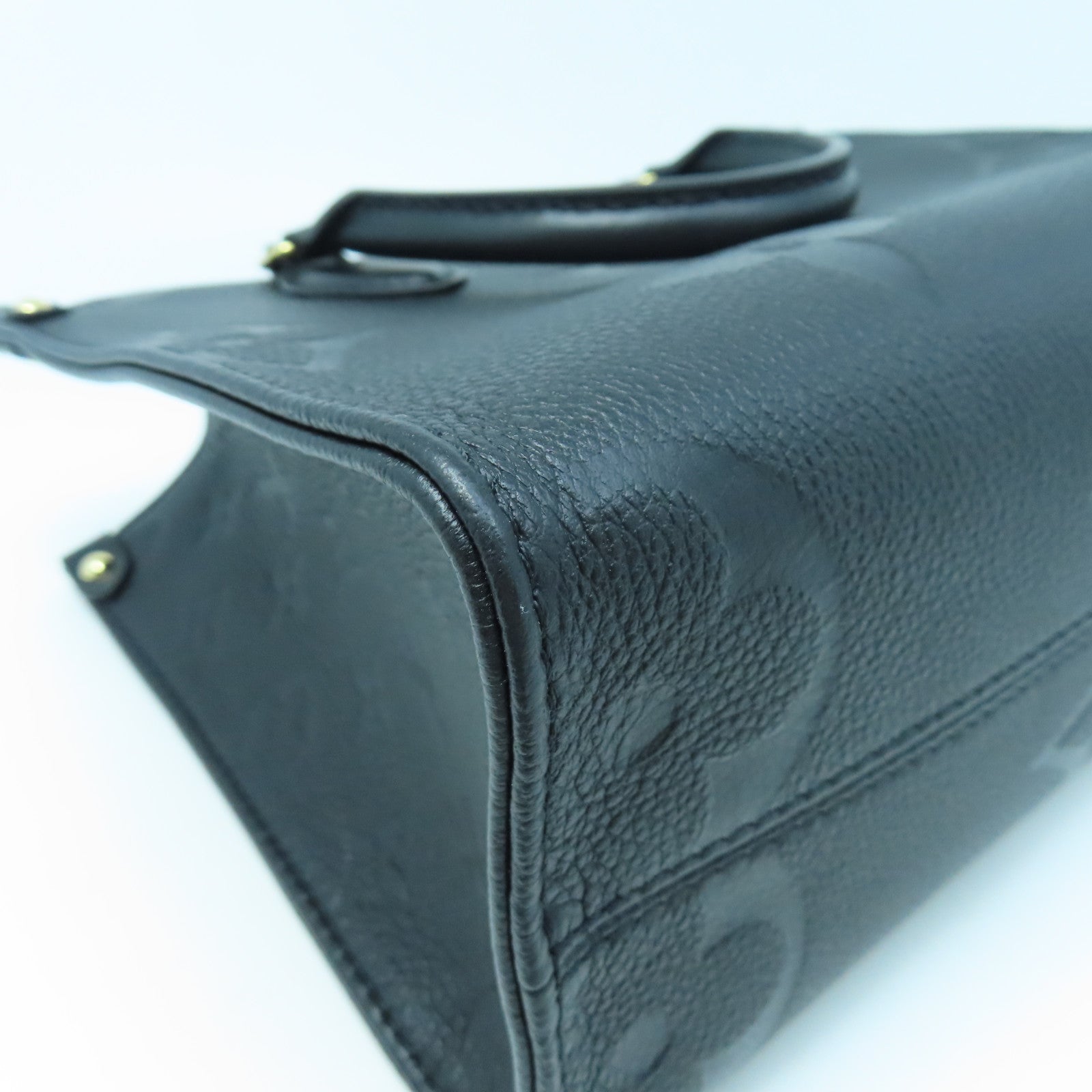 LOUIS VUITTON Monogram Empreinte On The Go PM gold buckle handle shoulder bag dual-use black