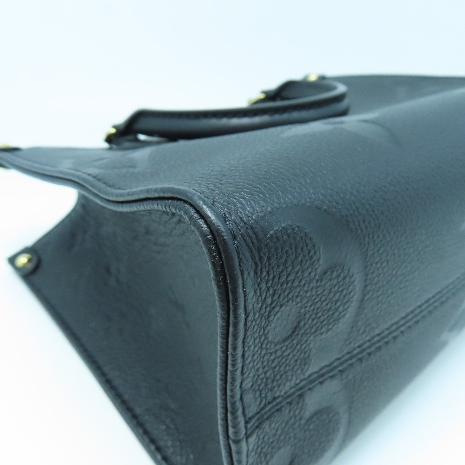 LOUIS VUITTON Monogram Empreinte On The Go PM gold buckle handle shoulder bag dual-use black