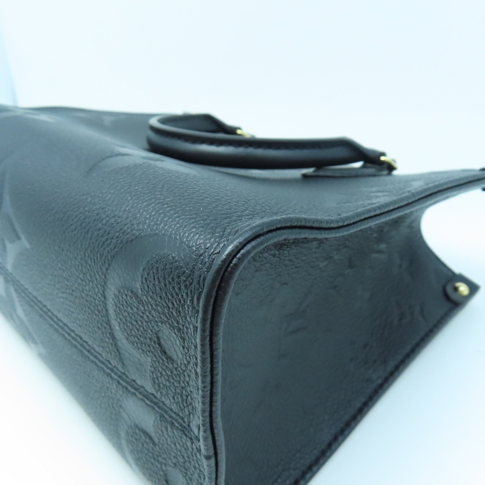 LOUIS VUITTON Monogram Empreinte On The Go PM gold buckle handle shoulder bag dual-use black