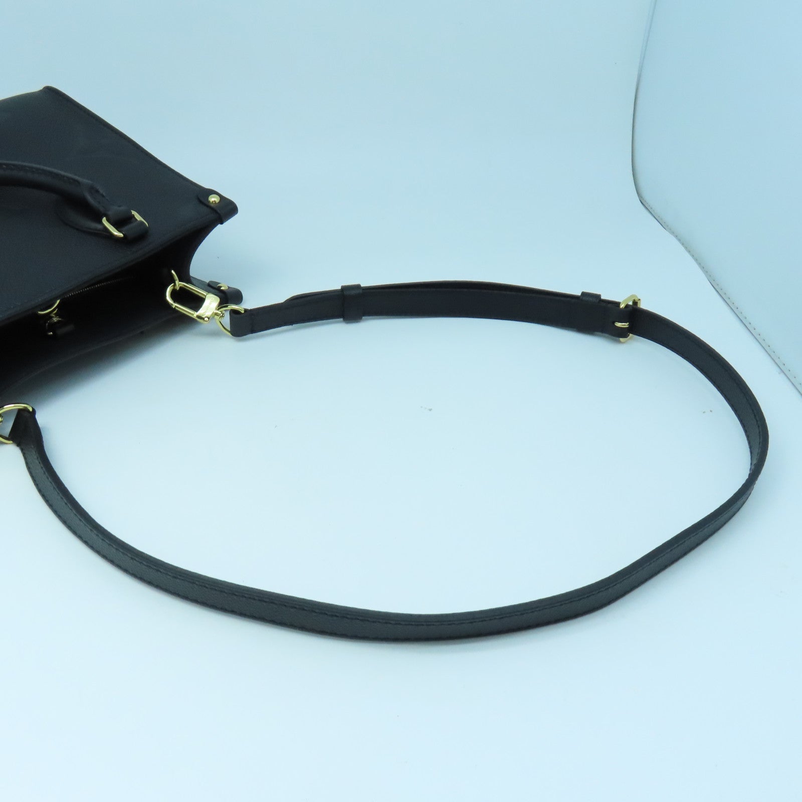 LOUIS VUITTON Monogram Empreinte On The Go PM gold buckle handle shoulder bag dual-use black