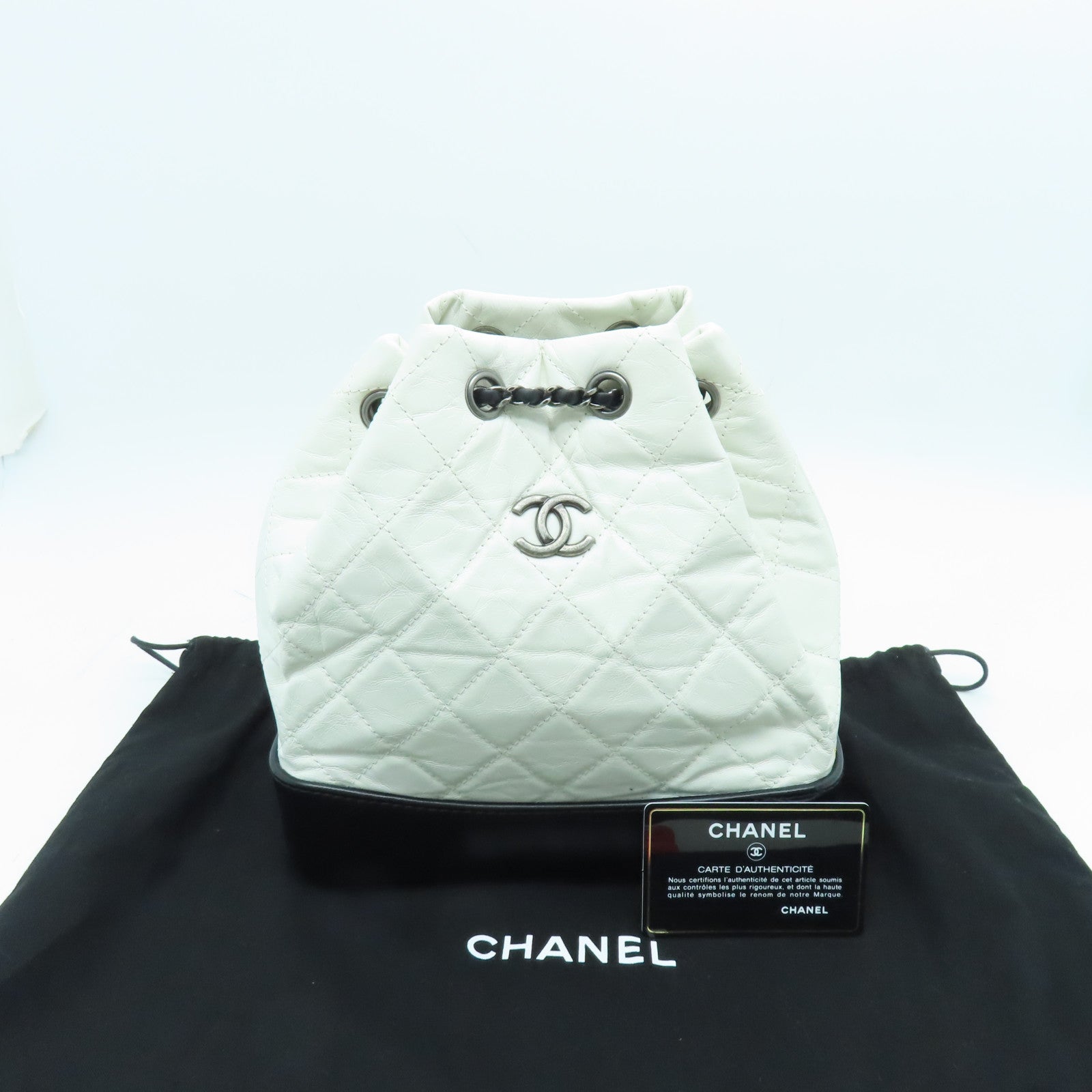 CHANEL cowhide leather Gabrielle Backpack gold and silver buckle backpack white / black