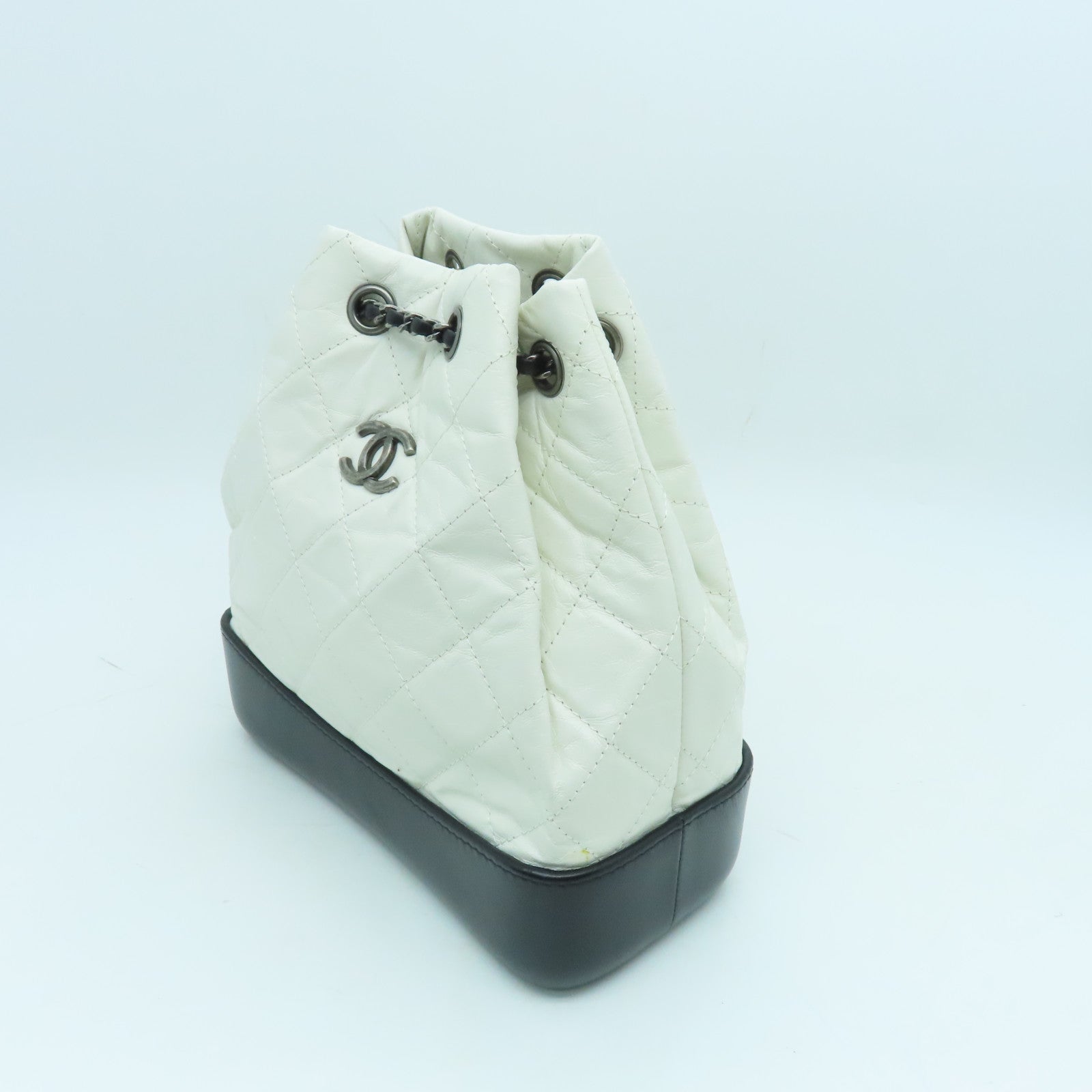 CHANEL cowhide leather Gabrielle Backpack gold and silver buckle backpack white / black