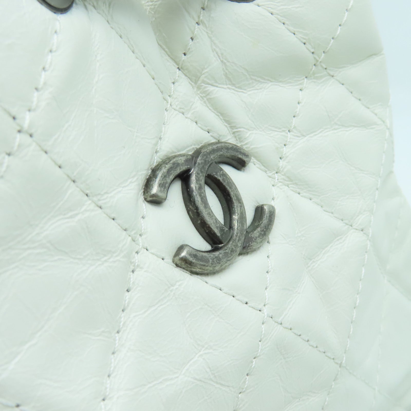 CHANEL cowhide leather Gabrielle Backpack gold and silver buckle backpack white / black