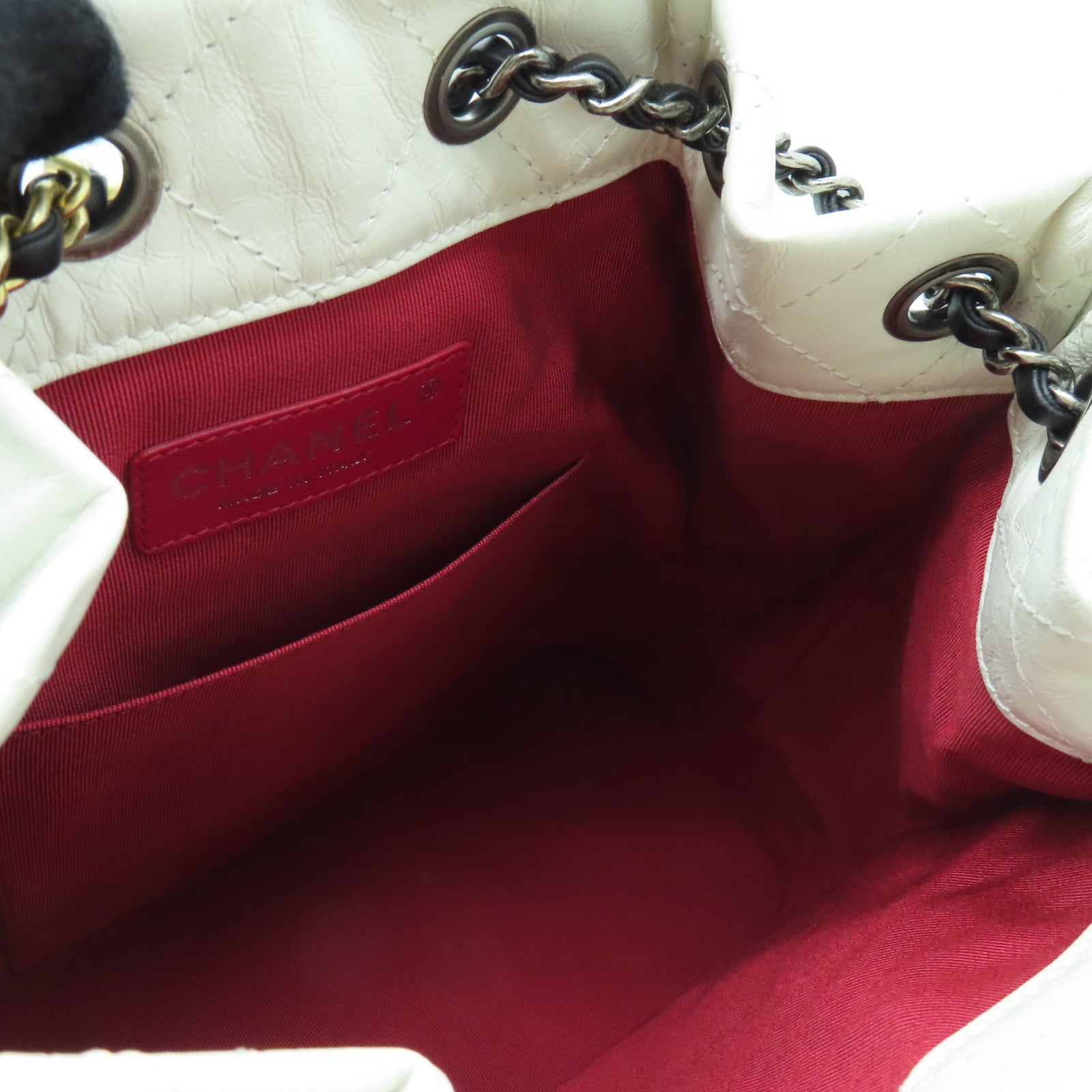 CHANEL cowhide leather Gabrielle Backpack gold and silver buckle backpack white / black