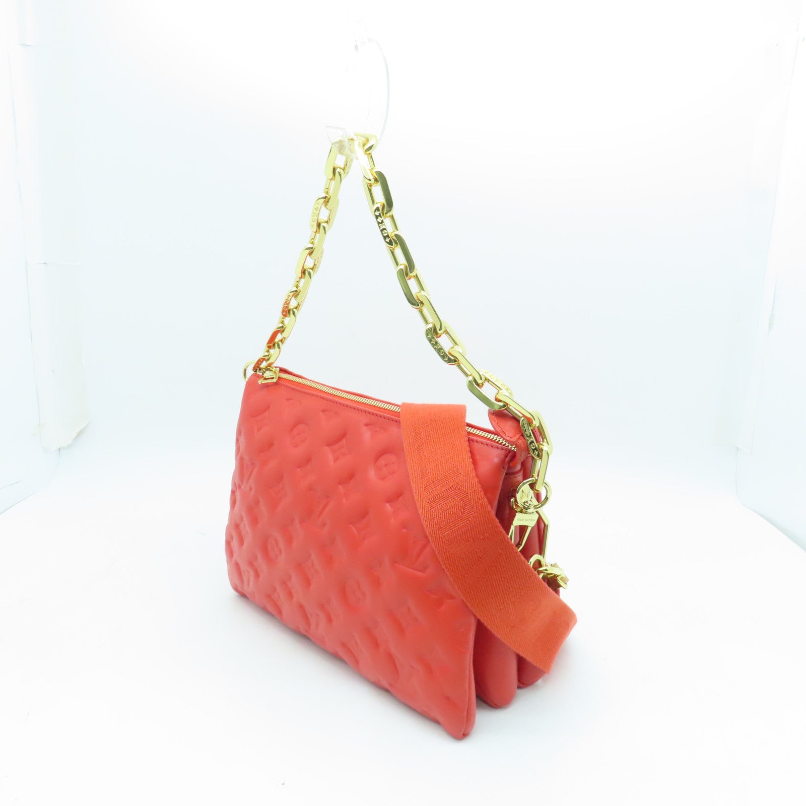 LOUIS VUITTON Monogram Embossed Coussin PM gold buckle handle shoulder bag red