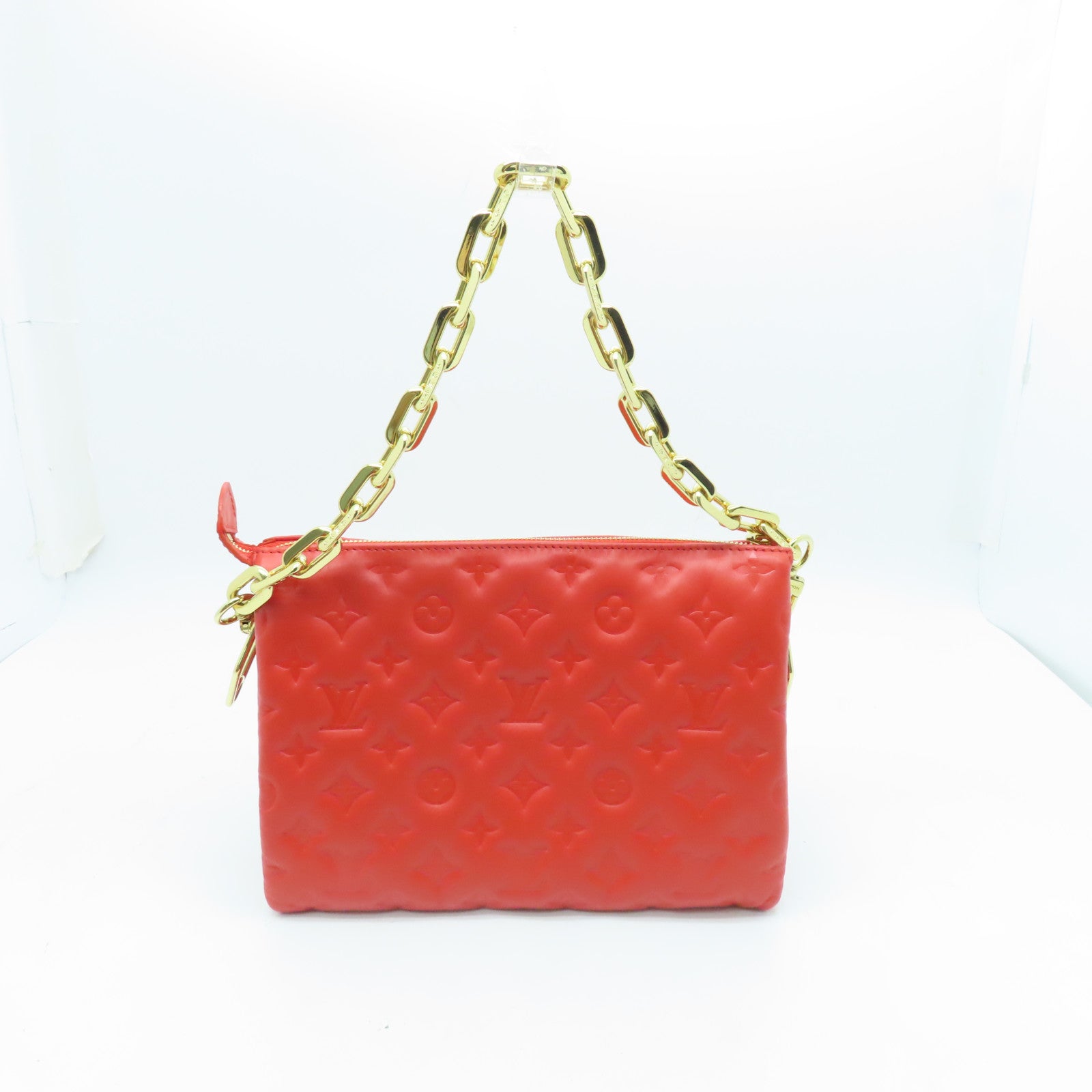 LOUIS VUITTON Monogram Embossed Coussin PM gold buckle handle shoulder bag red