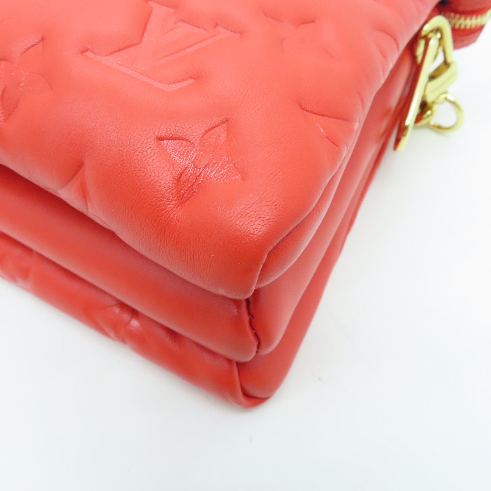 LOUIS VUITTON Monogram Embossed Coussin PM gold buckle handle shoulder bag red