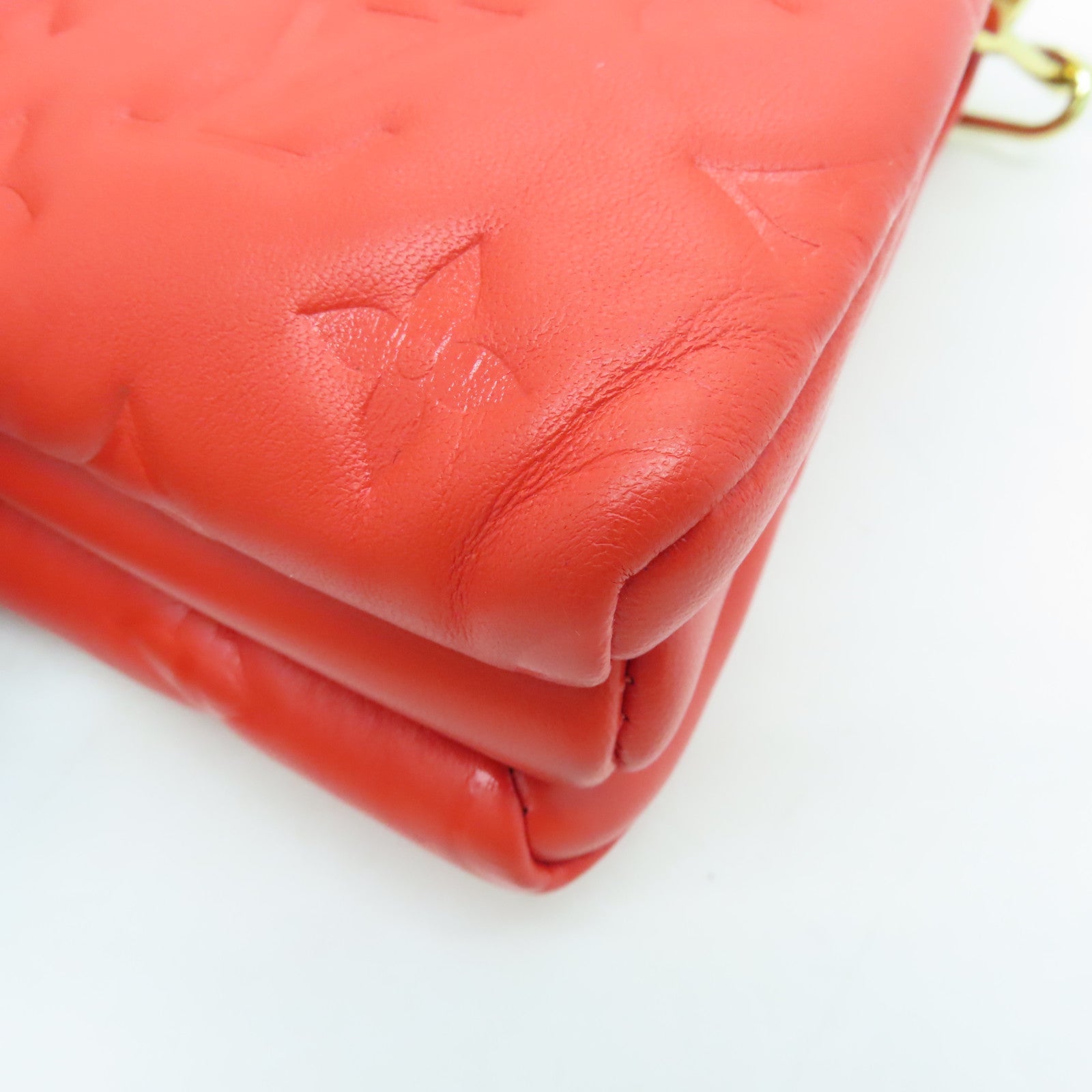 LOUIS VUITTON Monogram Embossed Coussin PM gold buckle handle shoulder bag red