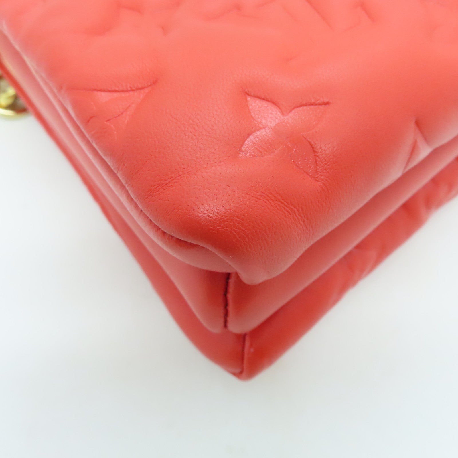 LOUIS VUITTON Monogram Embossed Coussin PM gold buckle handle shoulder bag red