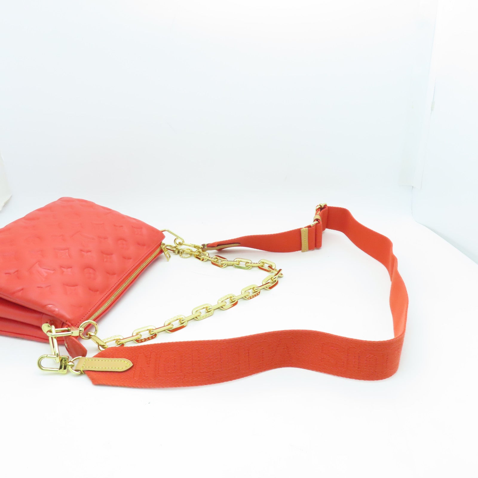 LOUIS VUITTON Monogram Embossed Coussin PM gold buckle handle shoulder bag red