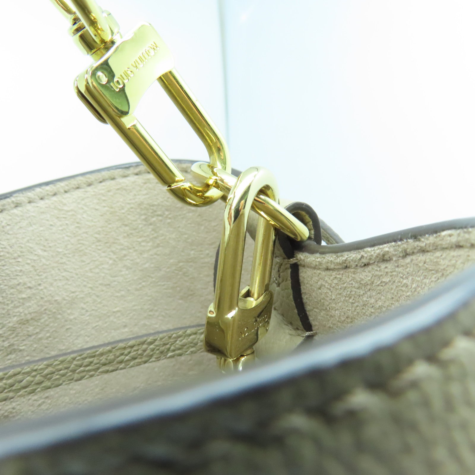 LOUIS VUITTON Mono Empreinte NeoNoe MM gold buckle handle bag beige