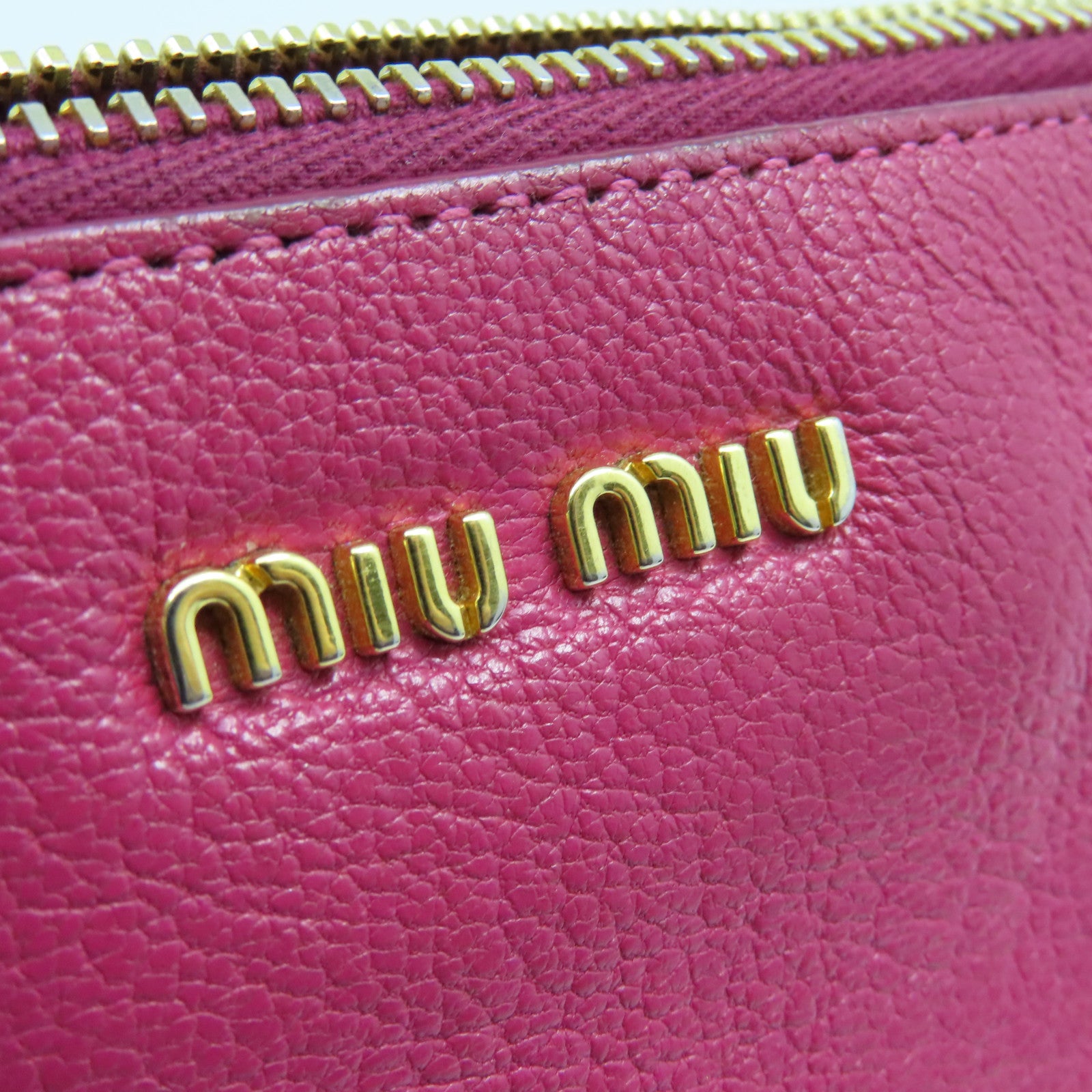 Miu Miu 【激減優惠】牛皮皮革Pouch金扣手拿包粉紅色紫色