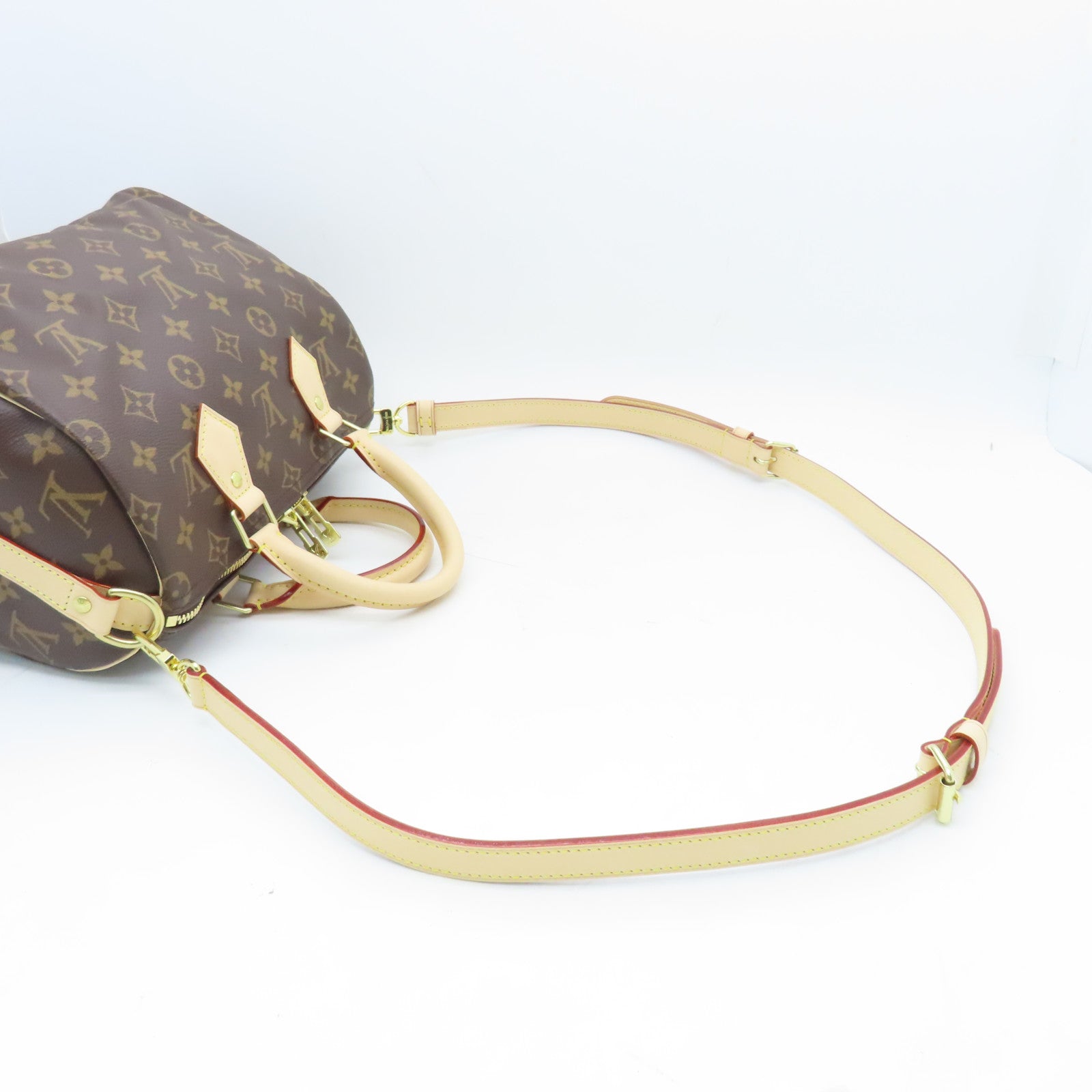 LOUIS VUITTON Monogram Speedy Bandouliere 25 gold buckle handle shoulder bag brown
