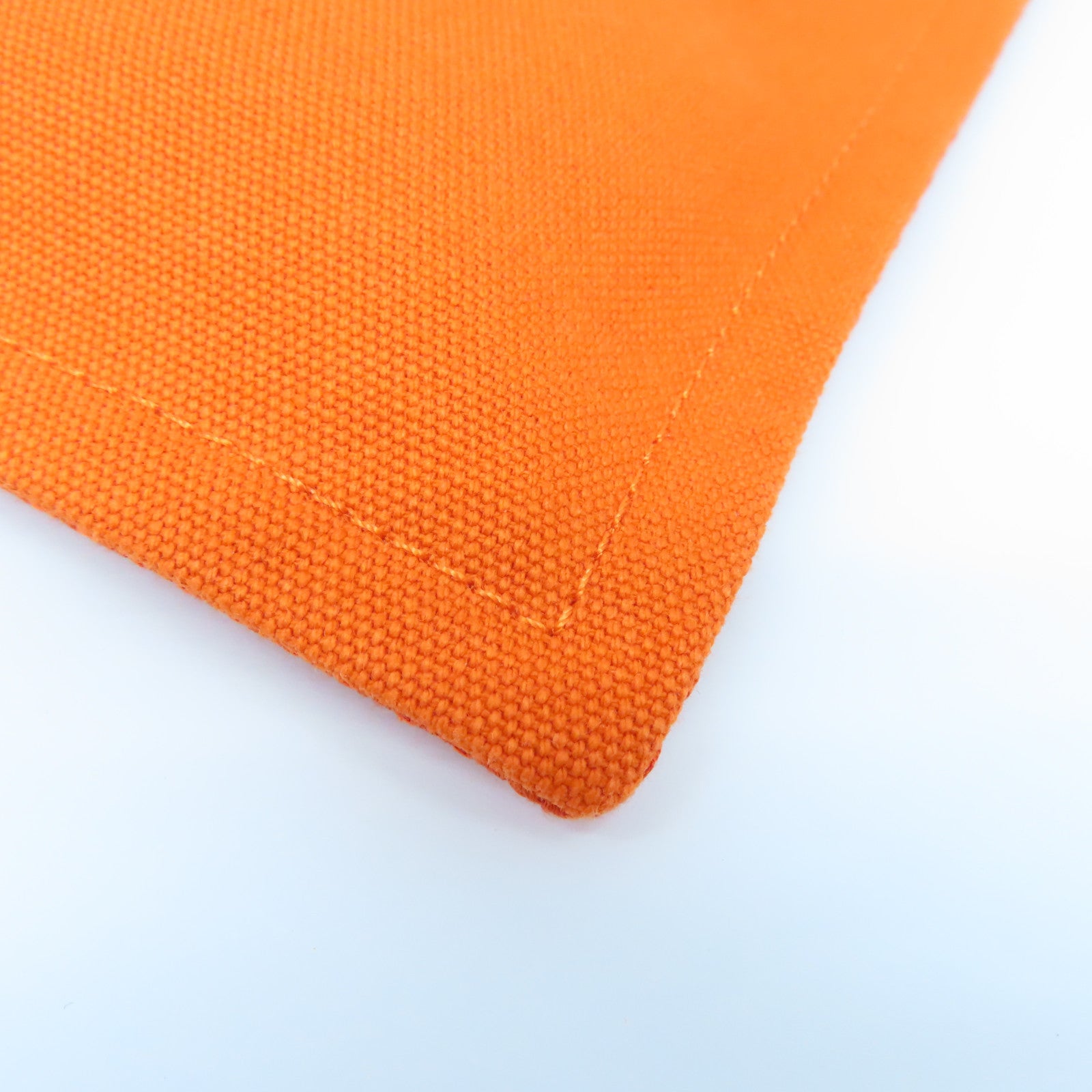 HERMES 帆布Bain Pouch金扣手拿包橙色