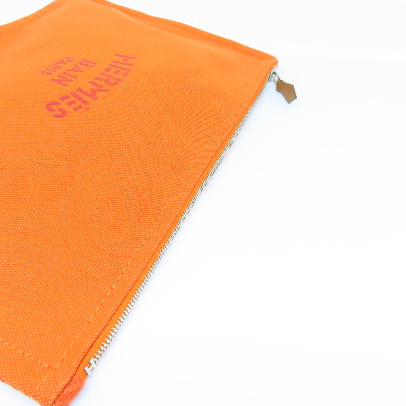 HERMES 帆布Bain Pouch金扣手拿包橙色