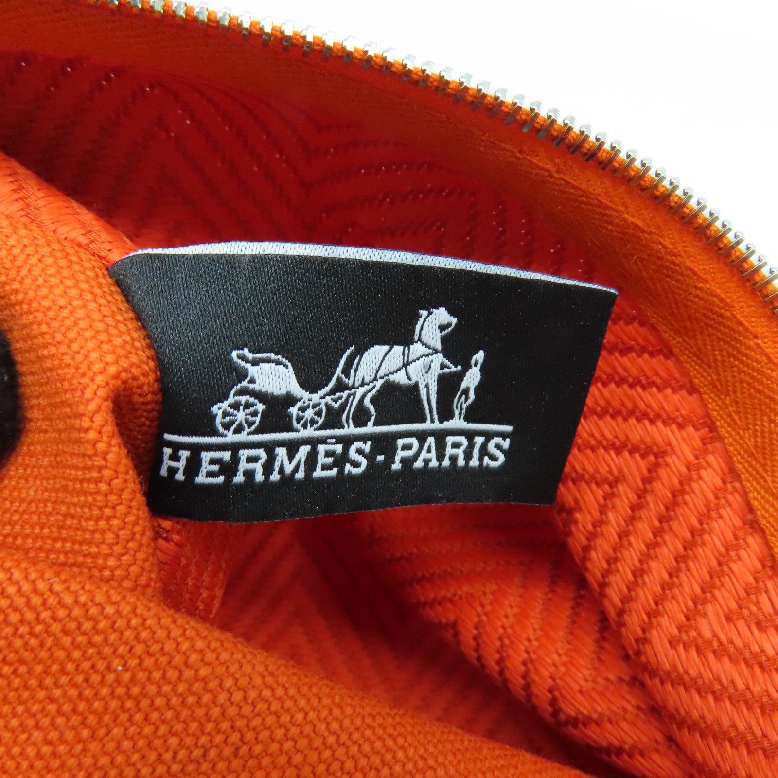 HERMES 帆布Bain Pouch金扣手拿包橙色