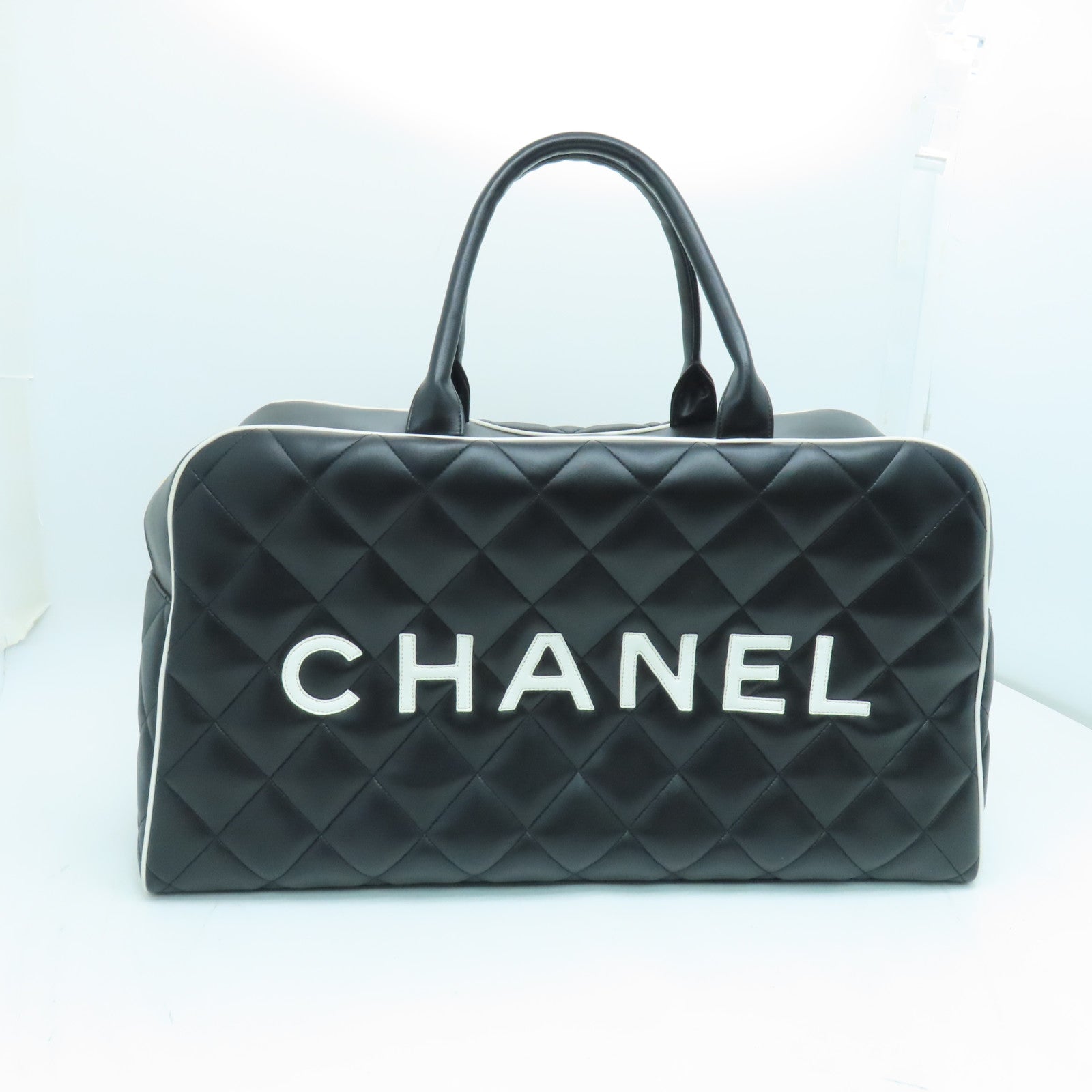 CHANEL 菱格牛皮皮革Travelling Bag金扣旅行袋黑色