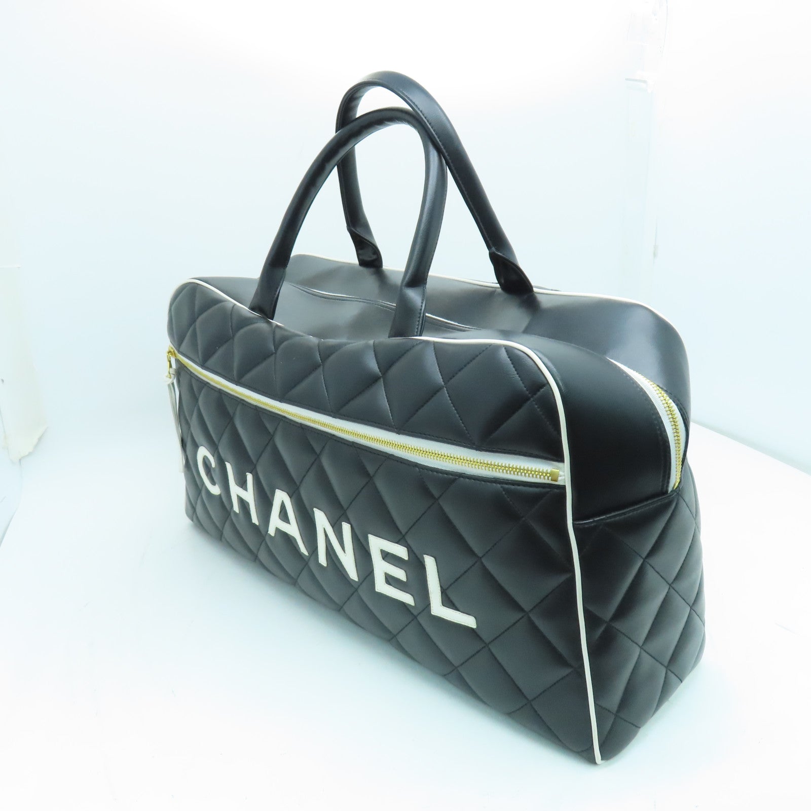 CHANEL 菱格牛皮皮革Travelling Bag金扣旅行袋黑色