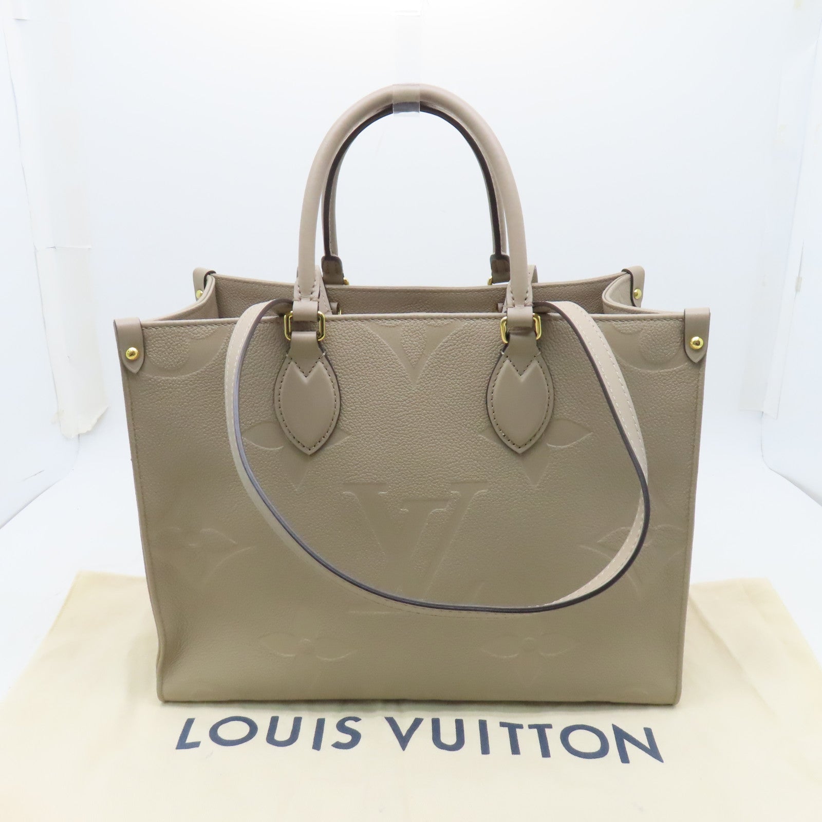 LOUIS VUITTON 【激減優惠】Monogram Empreinte Giant On The Go MM金扣手挽袋米色