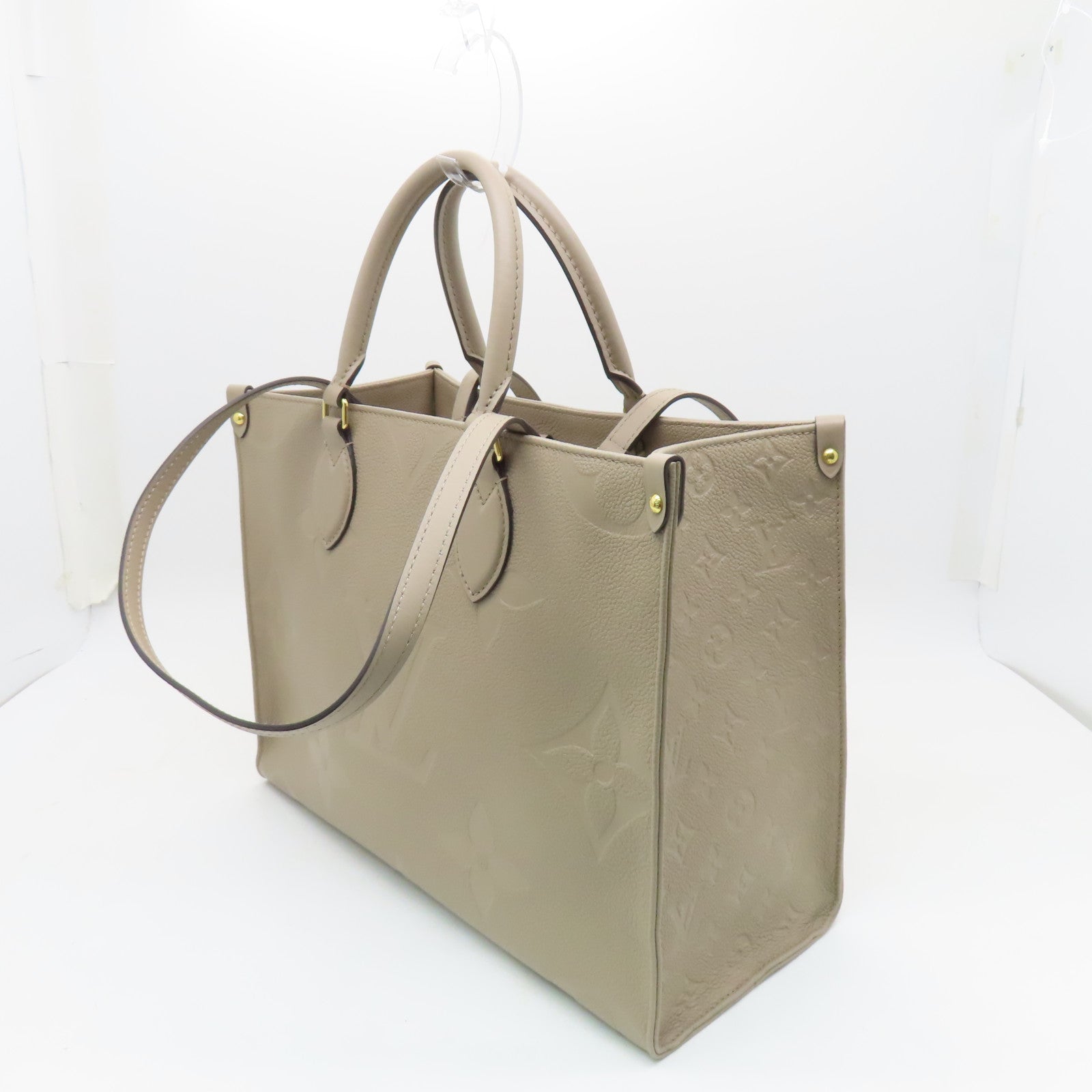 LOUIS VUITTON 【激減優惠】Monogram Empreinte Giant On The Go MM金扣手挽袋米色