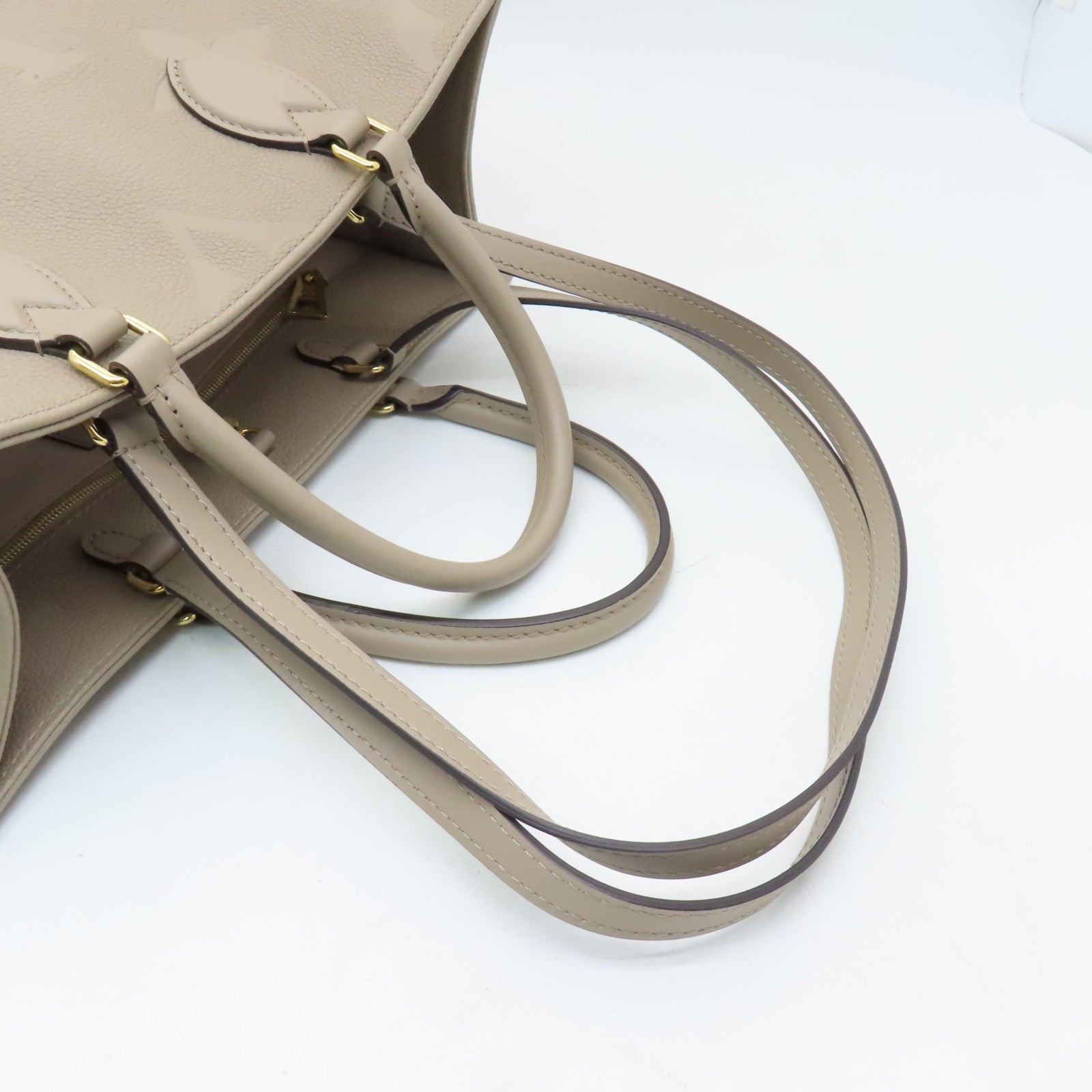 LOUIS VUITTON 【激減優惠】Monogram Empreinte Giant On The Go MM金扣手挽袋米色