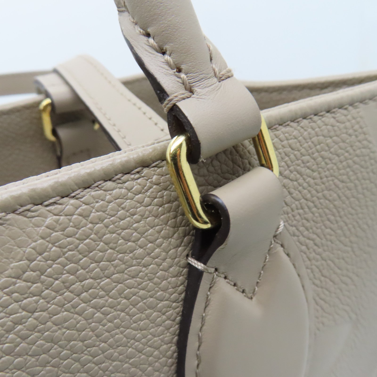 LOUIS VUITTON 【激減優惠】Monogram Empreinte Giant On The Go MM金扣手挽袋米色