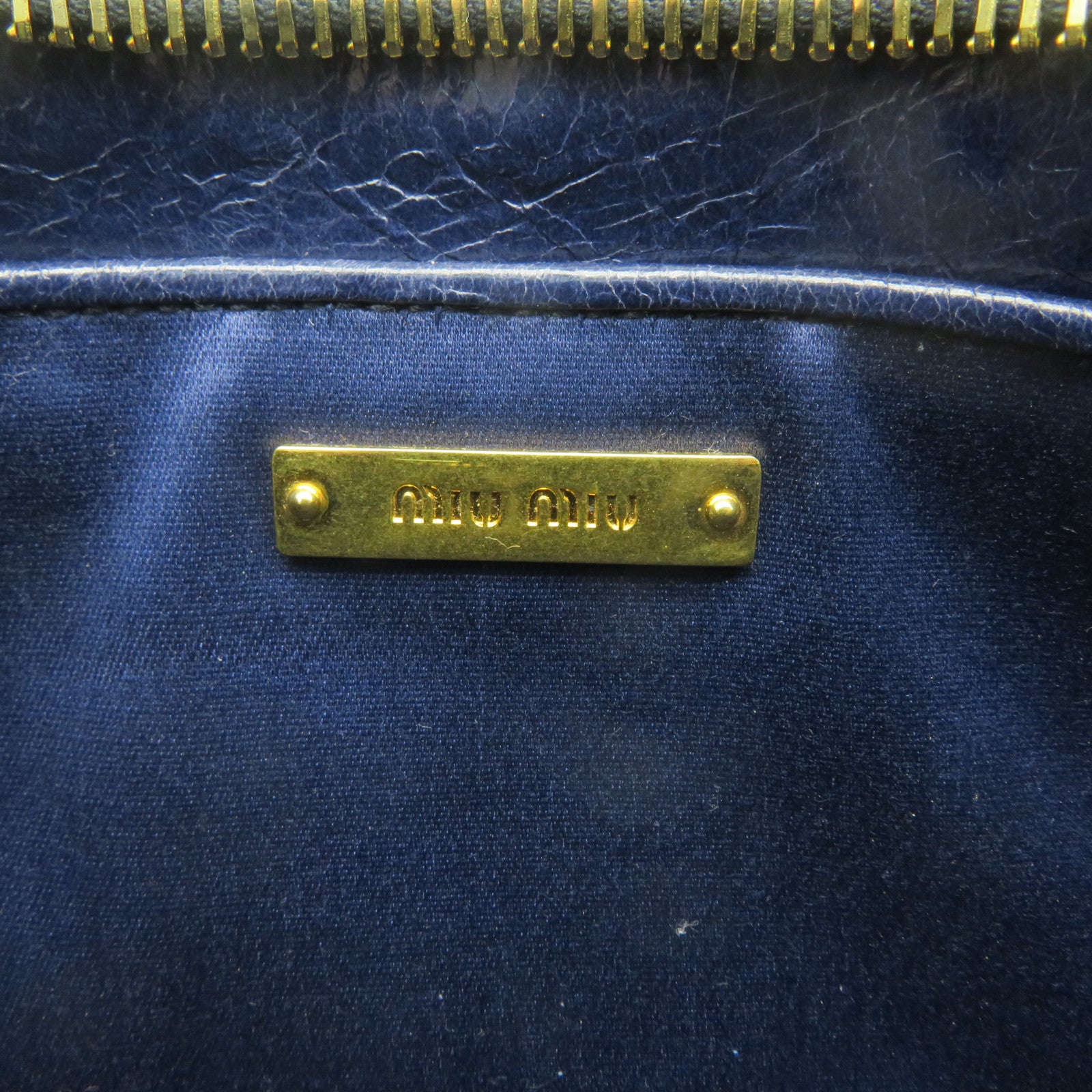 Miu Miu 牛皮皮革Clutch金扣手拿包宝蓝色