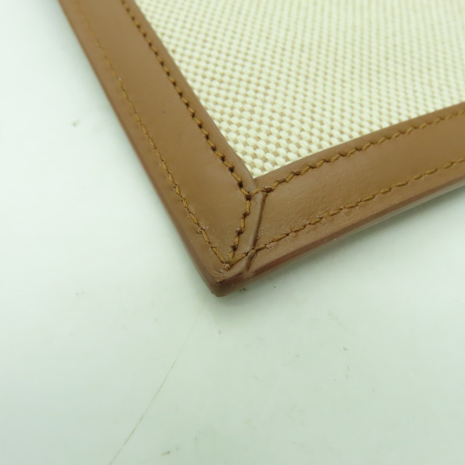 YVES SAINT LAURENT 帆布Clutch Bag金扣手拿包米色