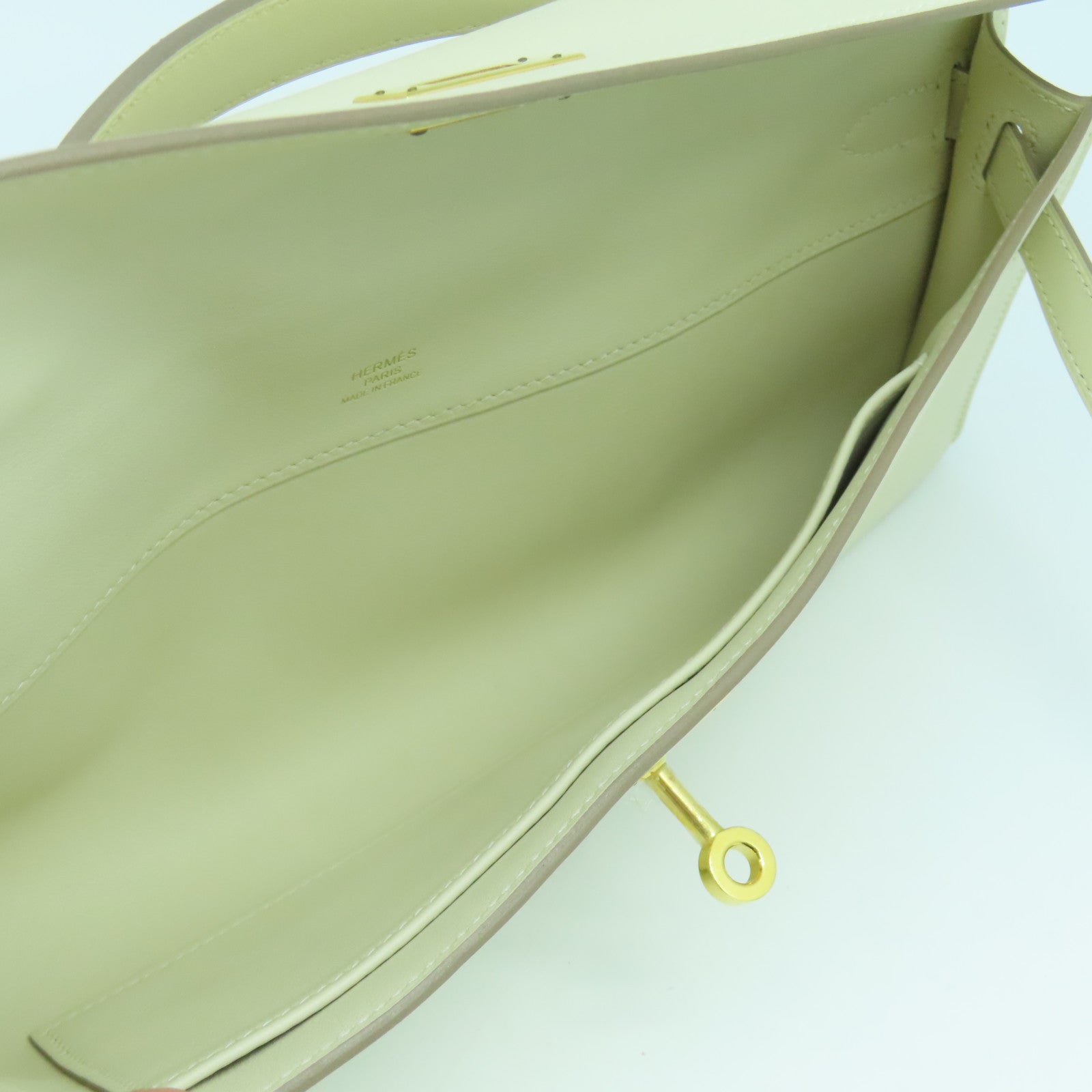 HERMES Swift皮革Kelly Cut金扣手挽袋奶昔白
