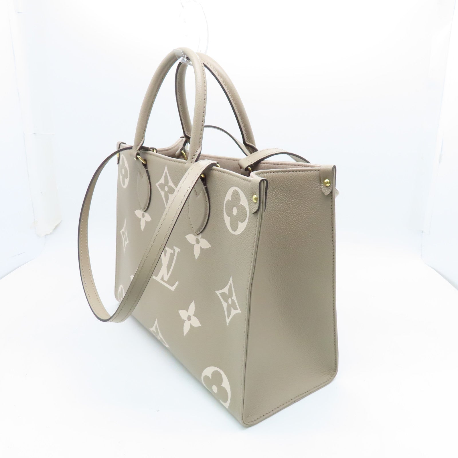 LOUIS VUITTON Monogram Empreinte Omthego MM Gold Buckle Handle Shoulder Backpack Beige