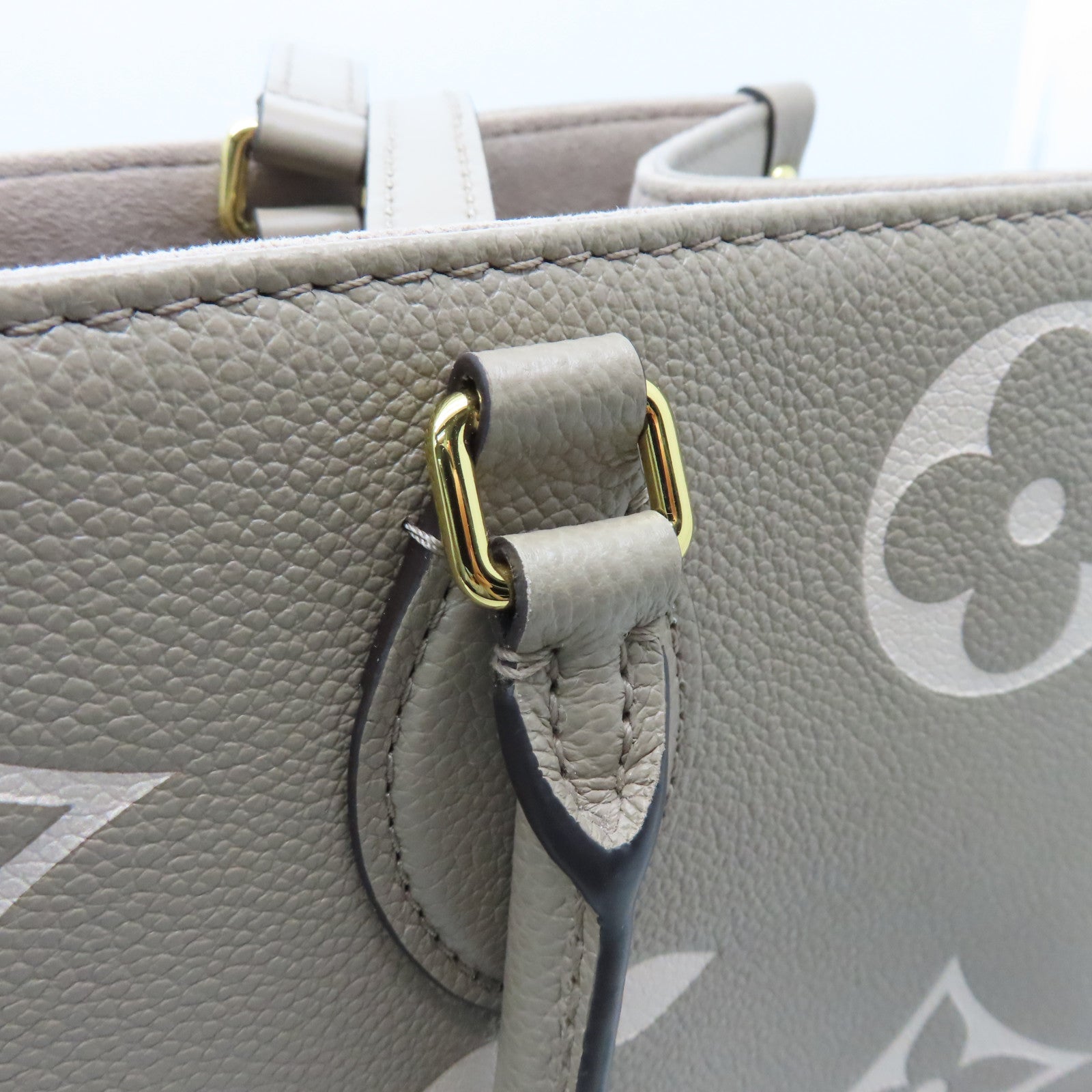 LOUIS VUITTON Monogram Empreinte Omthego MM Gold Buckle Handle Shoulder Backpack Beige