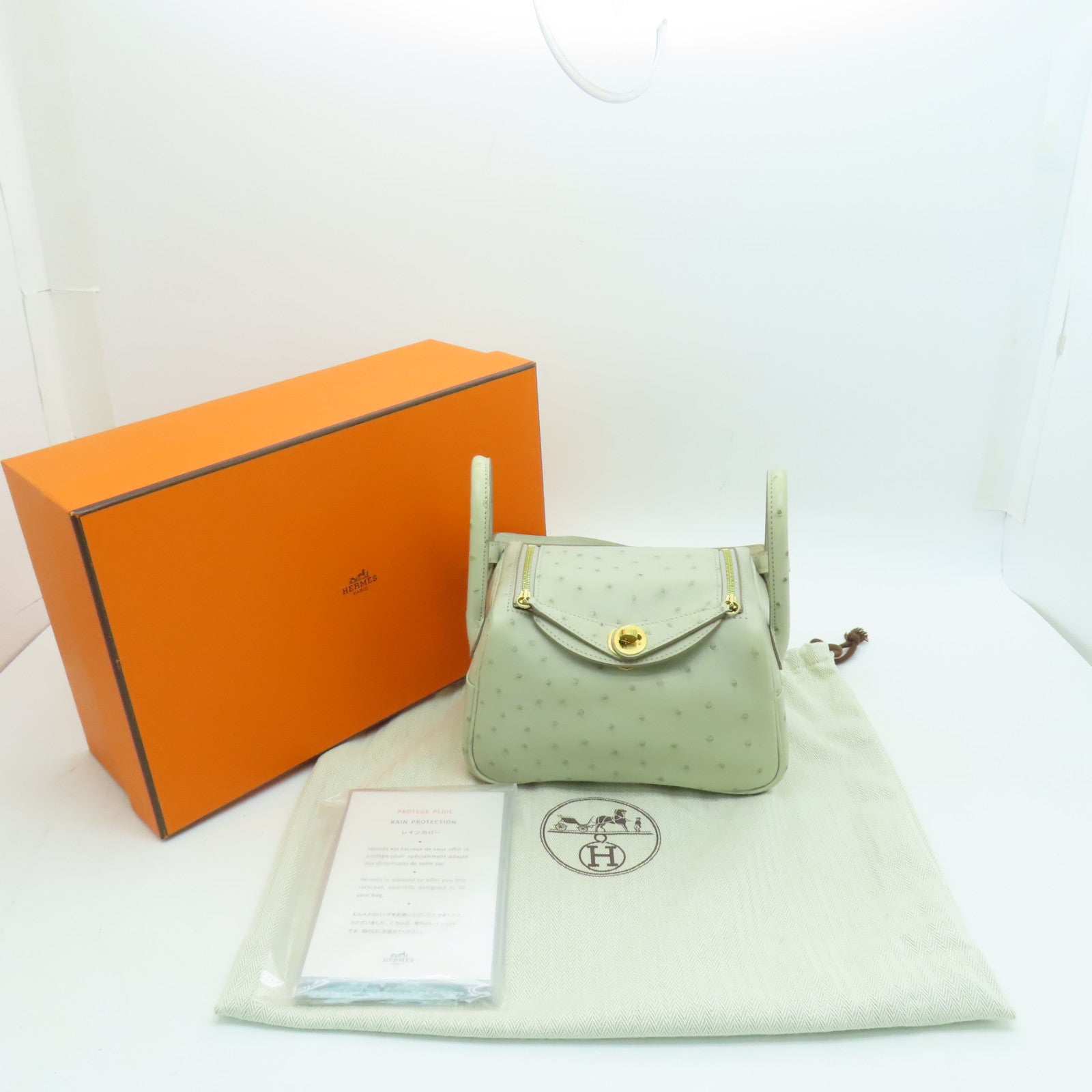 HERMES 鴕鳥皮革Mini Lindy金扣肩背袋淺灰色
