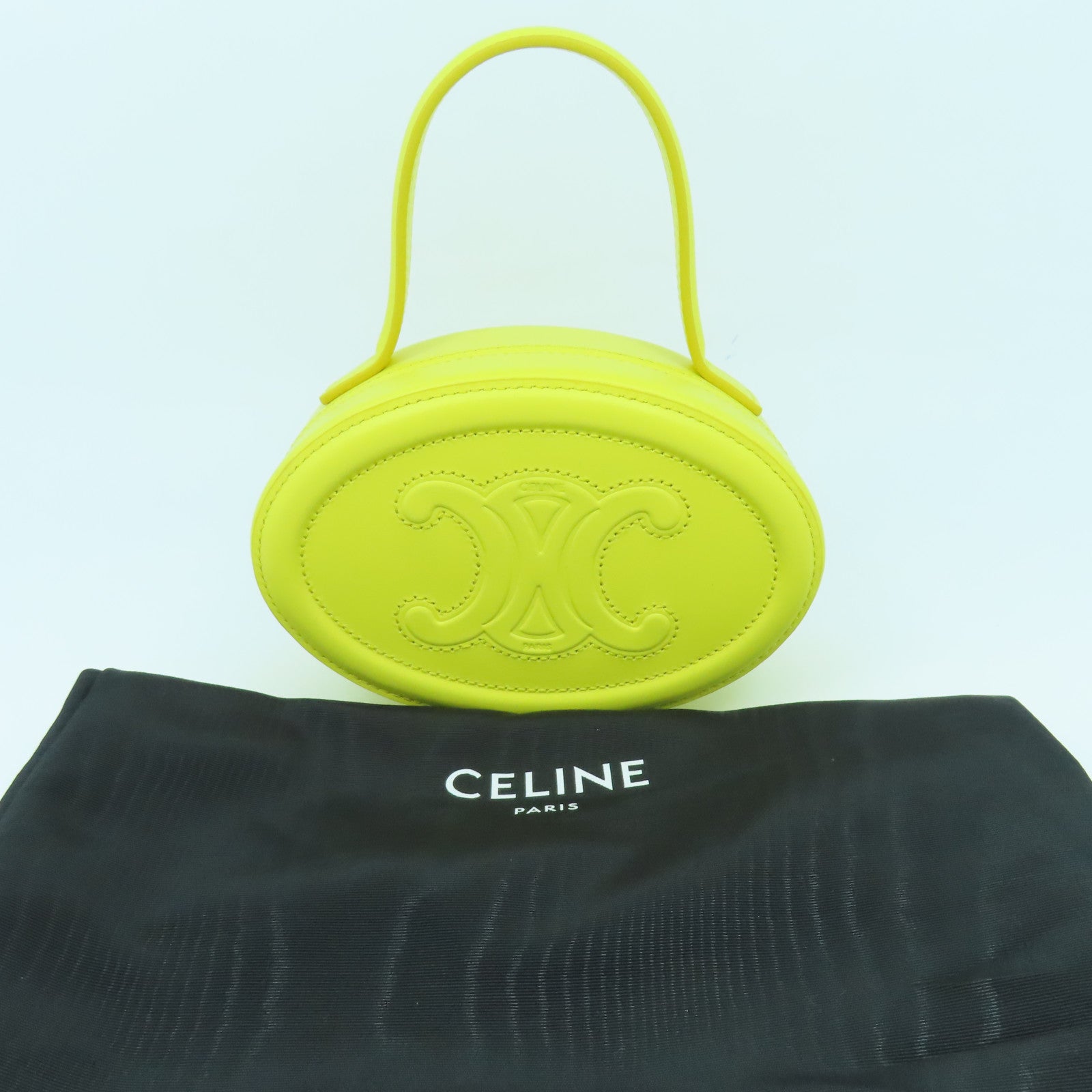 CELINE 牛皮皮革Cuir Triomphe Oval Minaudiere手挽袋黃色