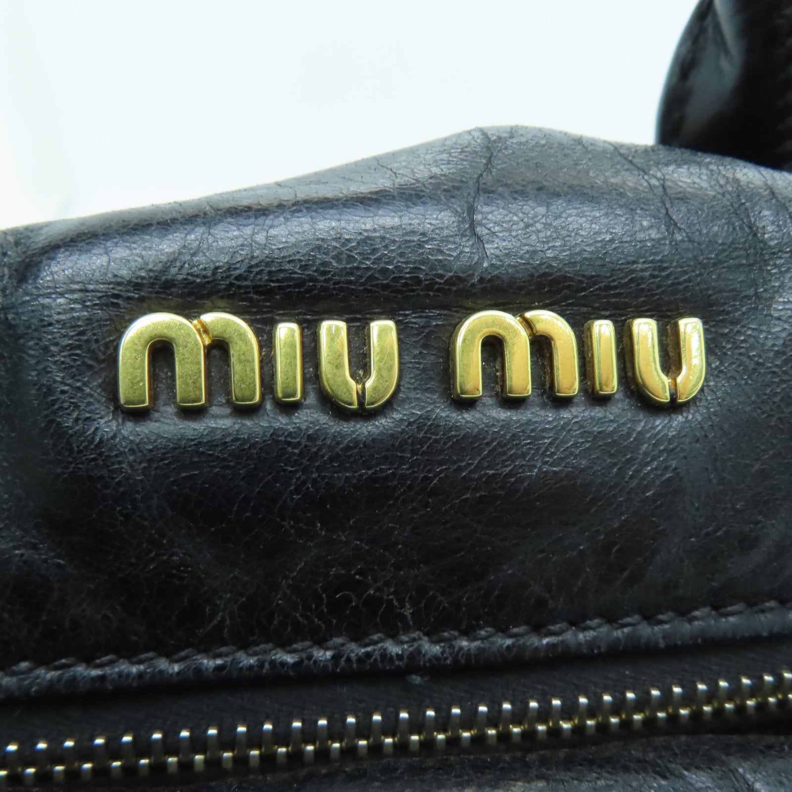 Miu Miu 牛皮皮革Handbag金扣手挽袋黑色