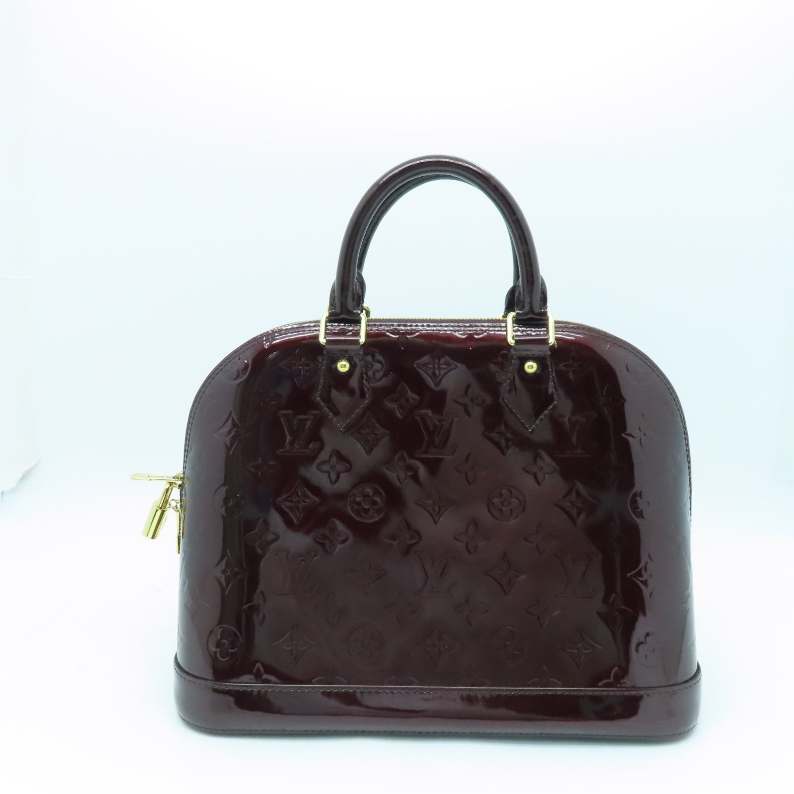 LOUIS VUITTON Monogram Vernis Alma PM gold buckle handle bag crimson